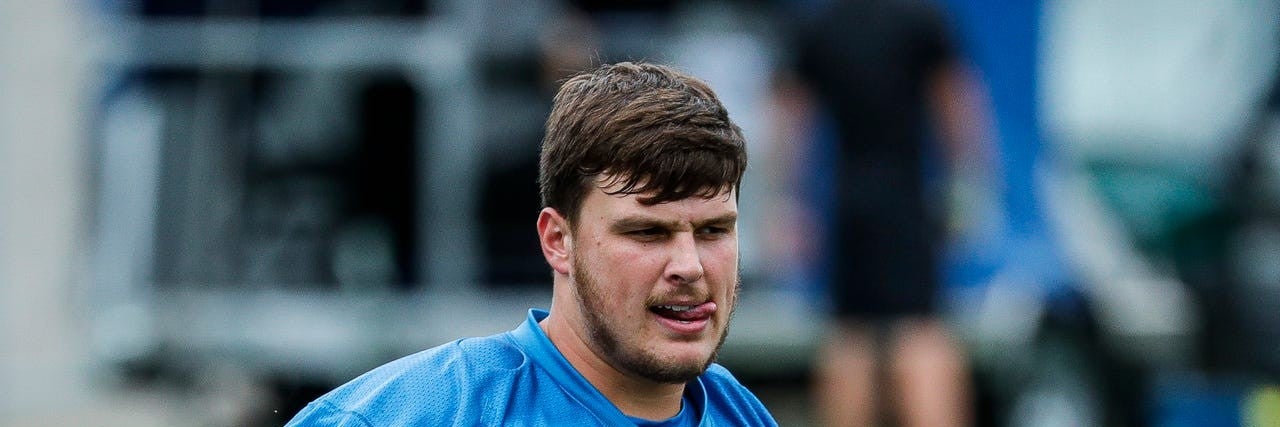 Detroit Lions center Ryan McCollum (74) warms up during mini camp at the practice facility in Allen Park on Tuesday, June 7, 2022.