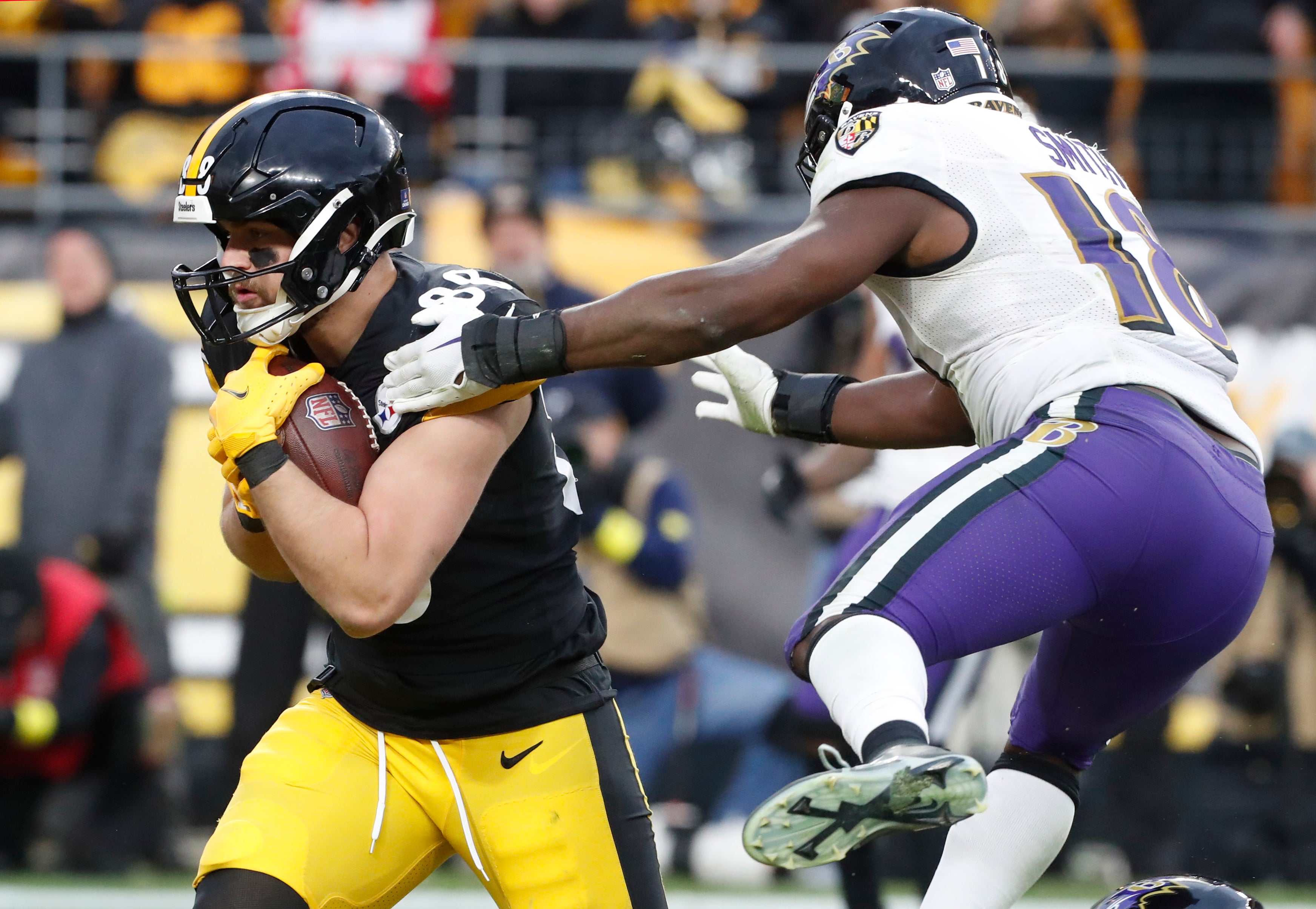 Dec 11, 2022; Pittsburgh, Pennsylvania, USA; Pittsburgh Steelers tight end Pat Freiermuth (88) catches a touchdown pass against Baltimore Ravens linebacker Roquan Smith (18) during the fourth quarter at Acrisure Stadium. Baltimore won 16-14. Mandatory Credit: Charles LeClaire-USA TODAY Sports