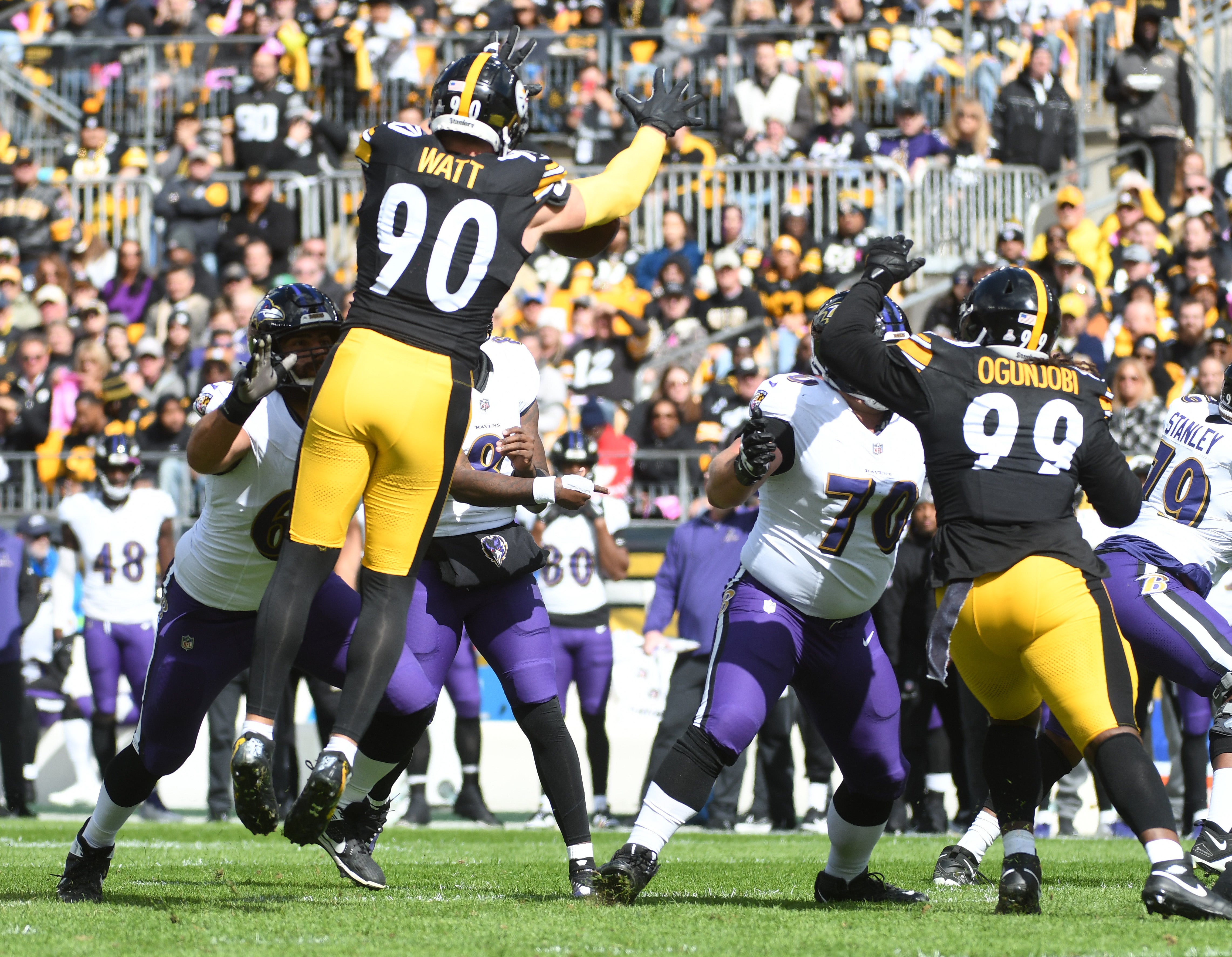 Oct 8, 2023; Pittsburgh, Pennsylvania, USA; Baltimore Ravens quarterback Lamar Jackson (8) has a pass blocked by Pittsburgh Steelers linebacker T.J. Watt (90) during the first quarter at Acrisure Stadium. Mandatory Credit: Philip G. Pavely-USA TODAY Sports