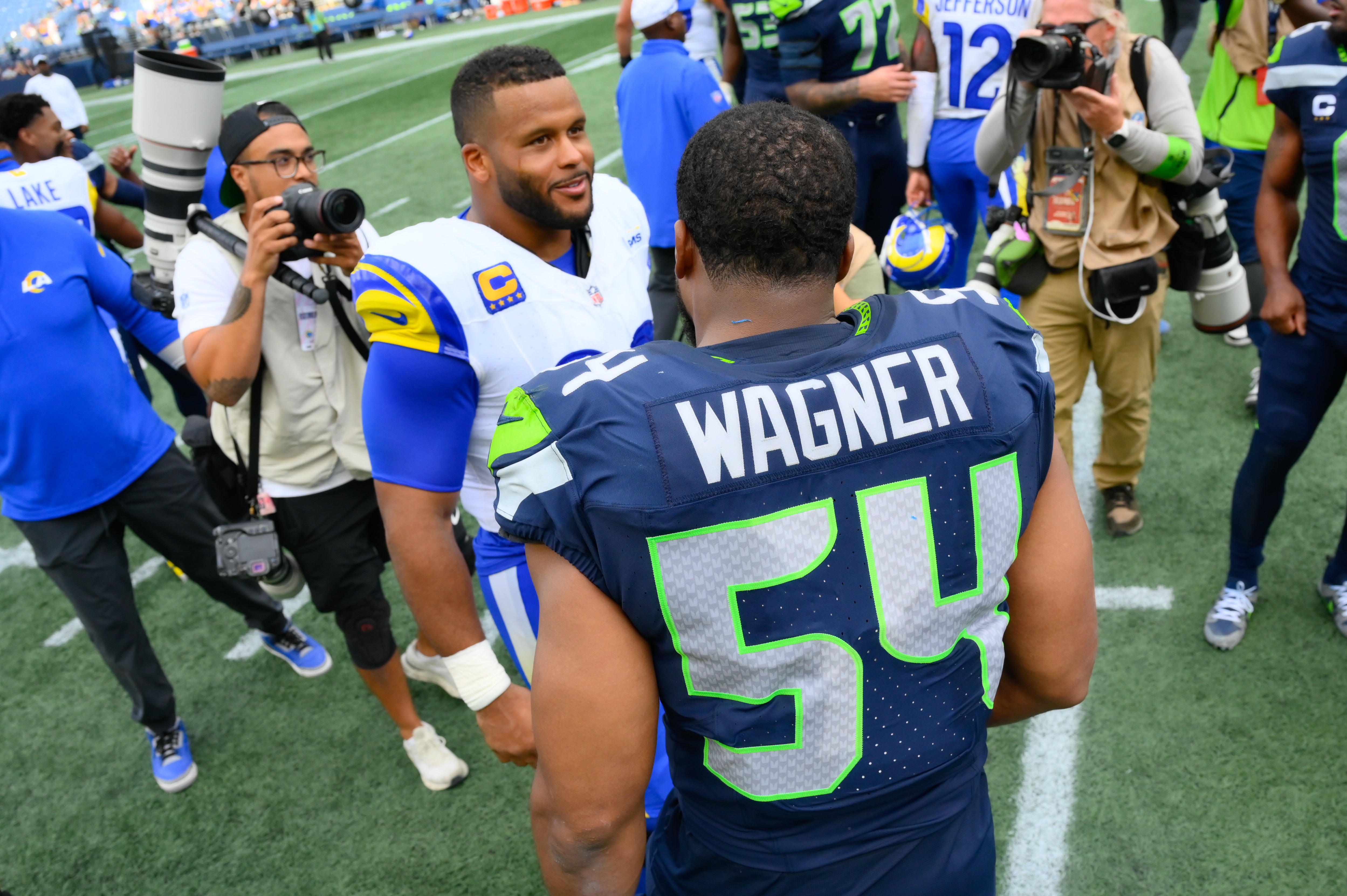 Sep 10, 2023; Seattle, Washington, USA; Los Angeles Rams defensive tackle Aaron Donald (99) and Seattle Seahawks linebacker Bobby Wagner (54) talk after the game at Lumen Field. Mandatory Credit: Steven Bisig-USA TODAY Sports