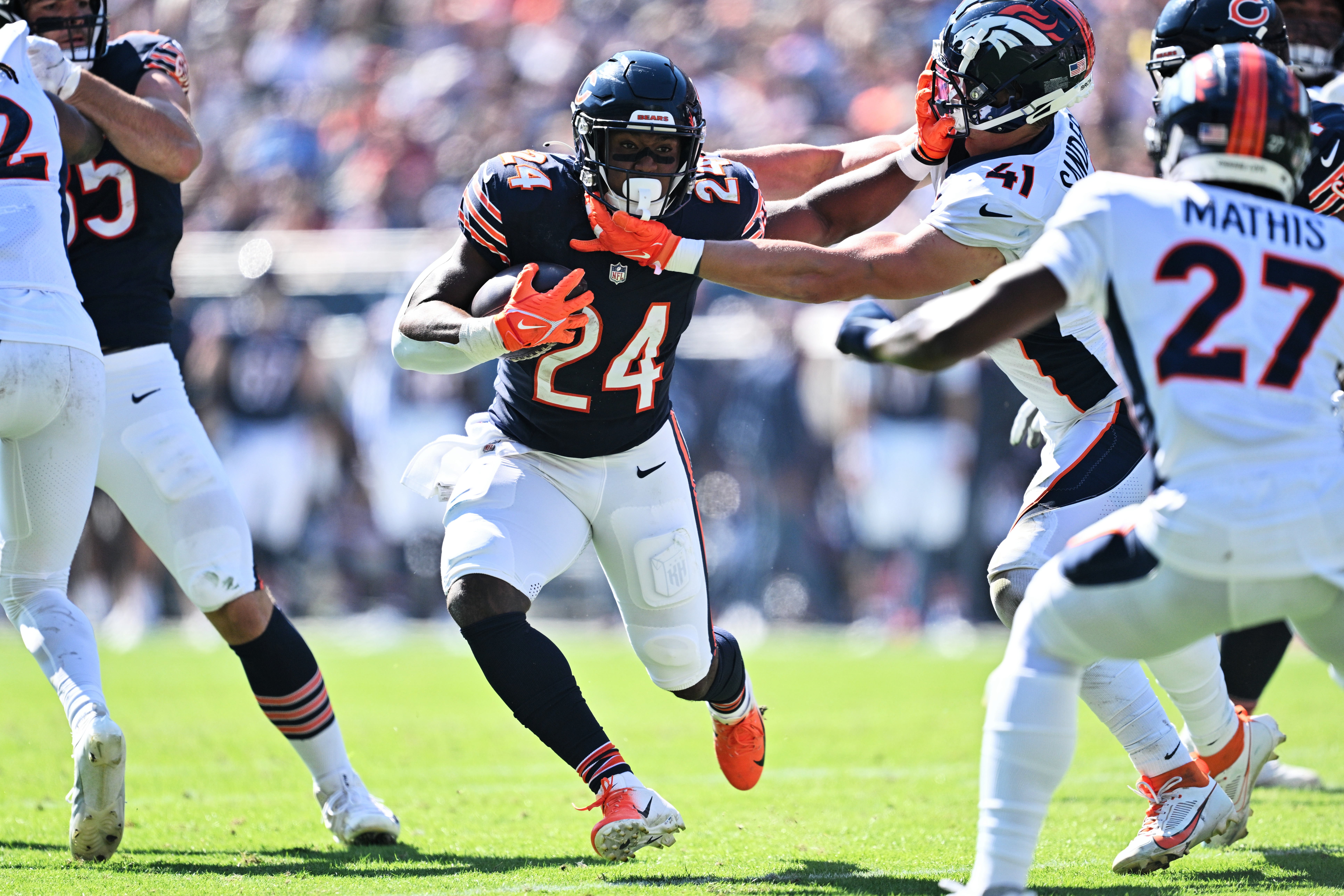 Oct 1, 2023; Chicago, Illinois, USA; Chicago Bears running back Khalil Herbert (24) runs for yardage in the second quarter against the Denver Broncos at Soldier Field.