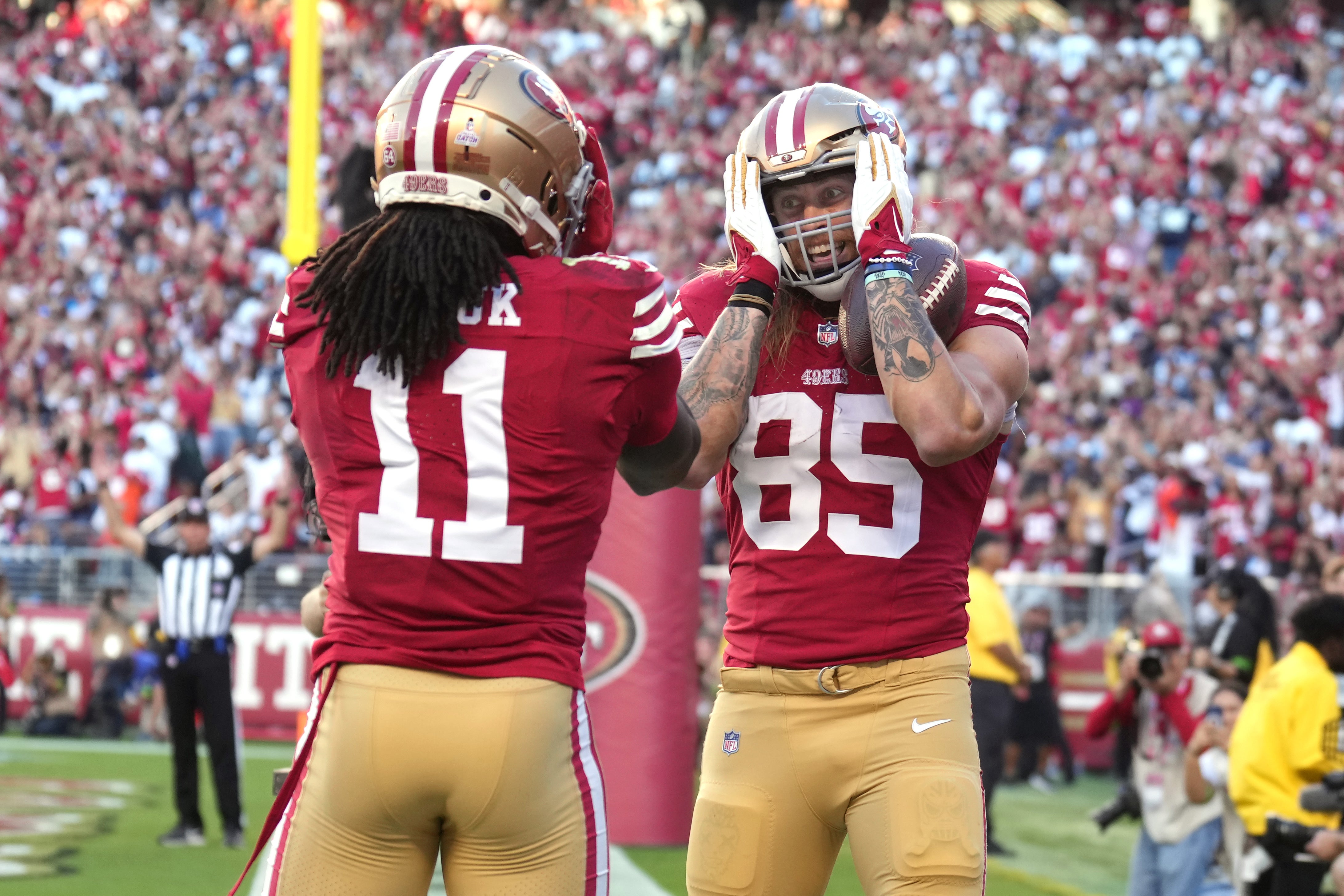 Oct 8, 2023; Santa Clara, California, USA; San Francisco 49ers tight end George Kittle (85) celebrates with wide receiver Brandon Aiyuk (11) after catching a touchdown pass against the Dallas Cowboys during the first quarter at Levi's Stadium.
