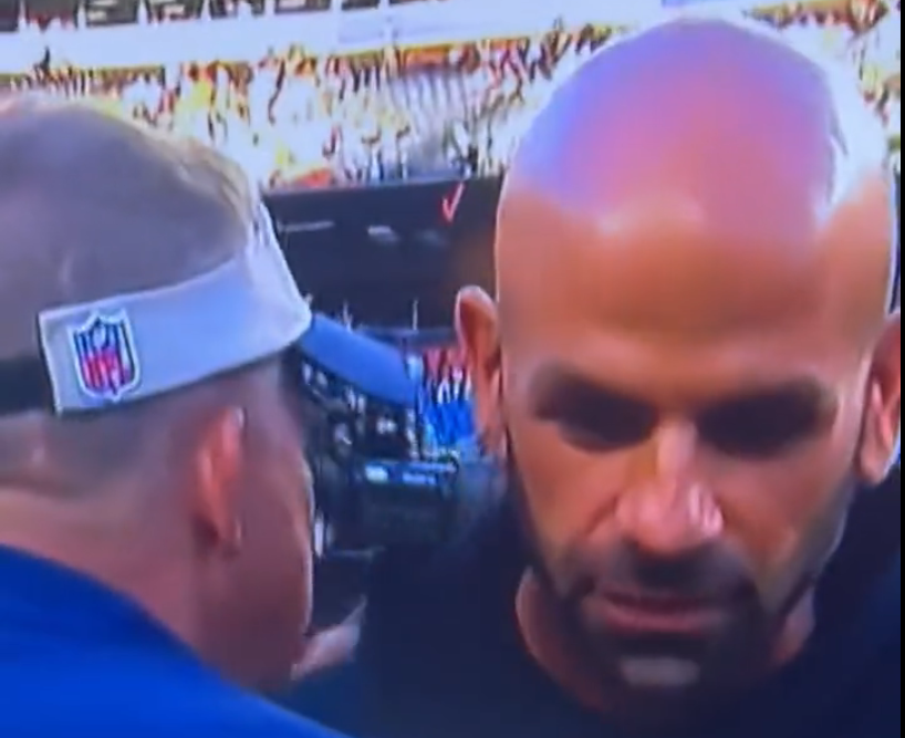 Jets head coach Robert Saleh meeting with Broncos head coach Sean Payton after their game