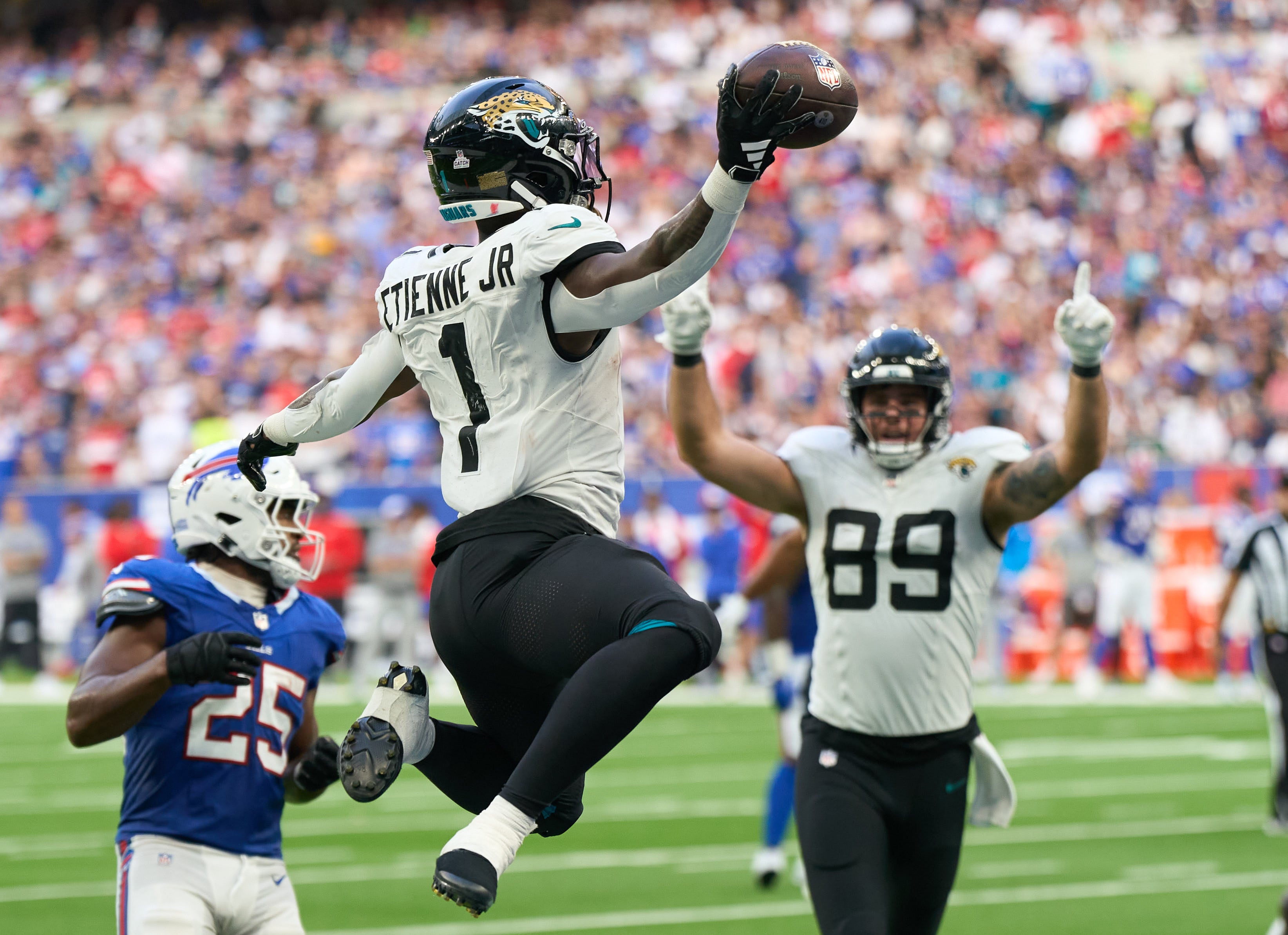 Jacksonville Jaguars RB Travis Etienne scoring a touchdown late in the game against the Buffalo Bills in London