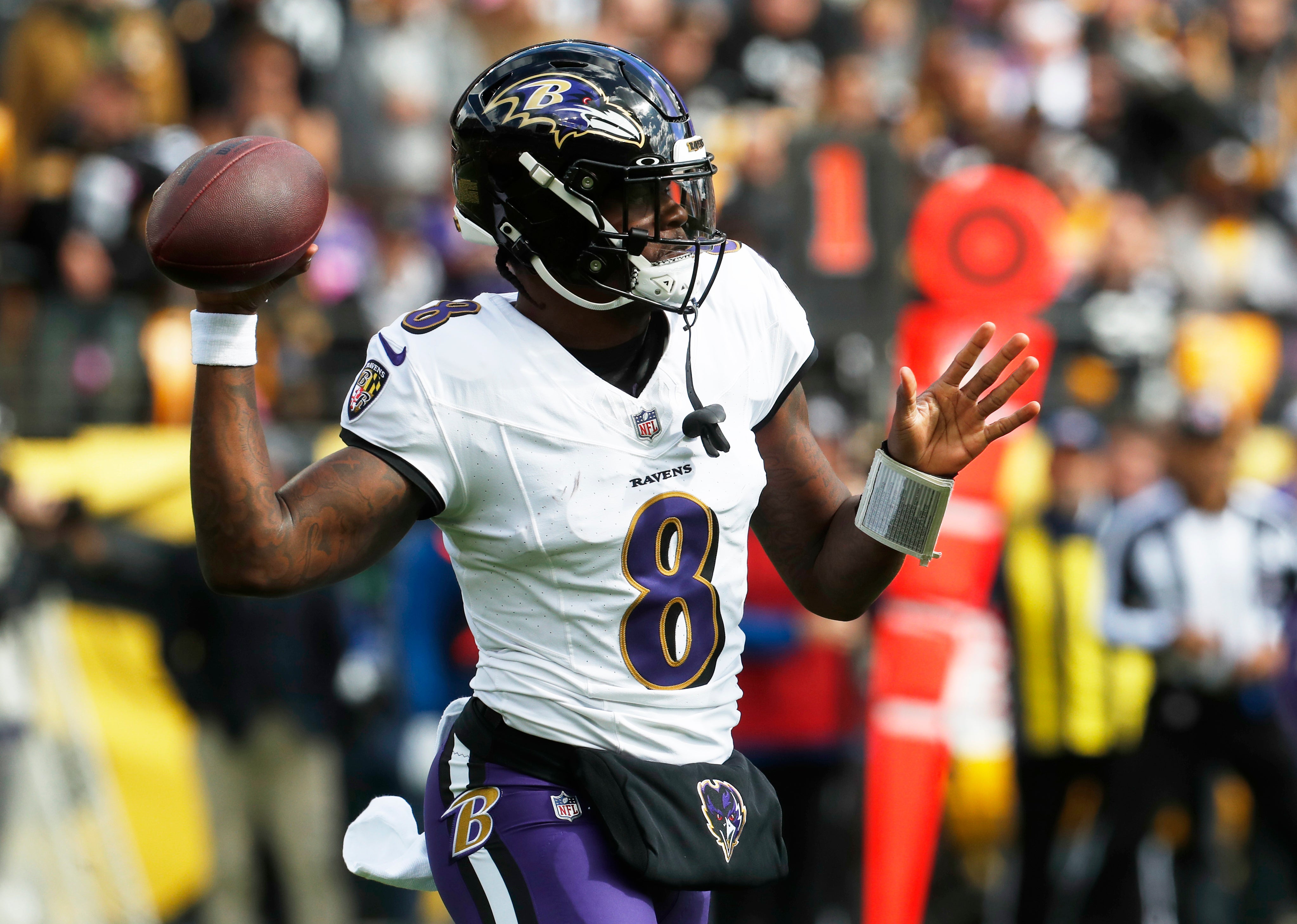 Baltimore Ravens quarterback Lamar Jackson (8) passes the ball against the Pittsburgh Steelers during the first quarter at Acrisure Stadium.