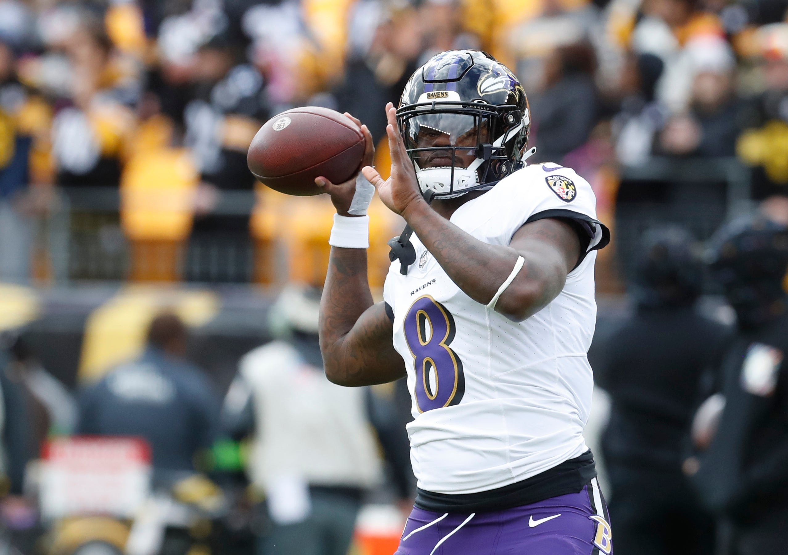 Baltimore Ravens quarterback Lamar Jackson (8) warms up before the game against the Pittsburgh Steelers at Acrisure Stadium.