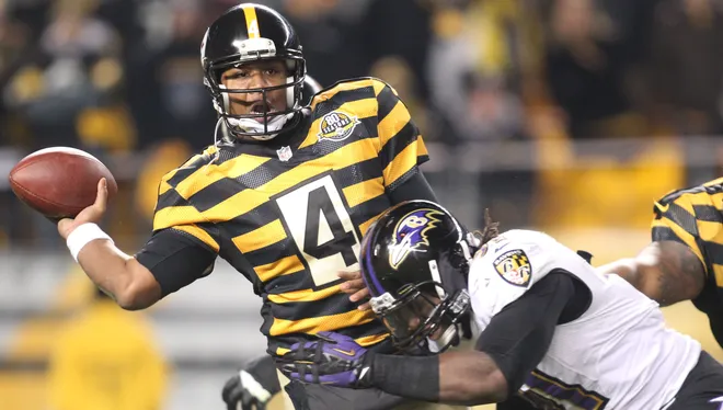 November 18, 2012; Pittsburgh, PA, USA; Pittsburgh Steelers quarterback Byron Leftwich (4) passes under pressure from Baltimore Ravens strong safety Bernard Pollard (31) during the fourth quarter at Heinz Field. The Baltimore Ravens won 13-10. Mandatory Credit: Charles LeClaire-USA TODAY Sports  