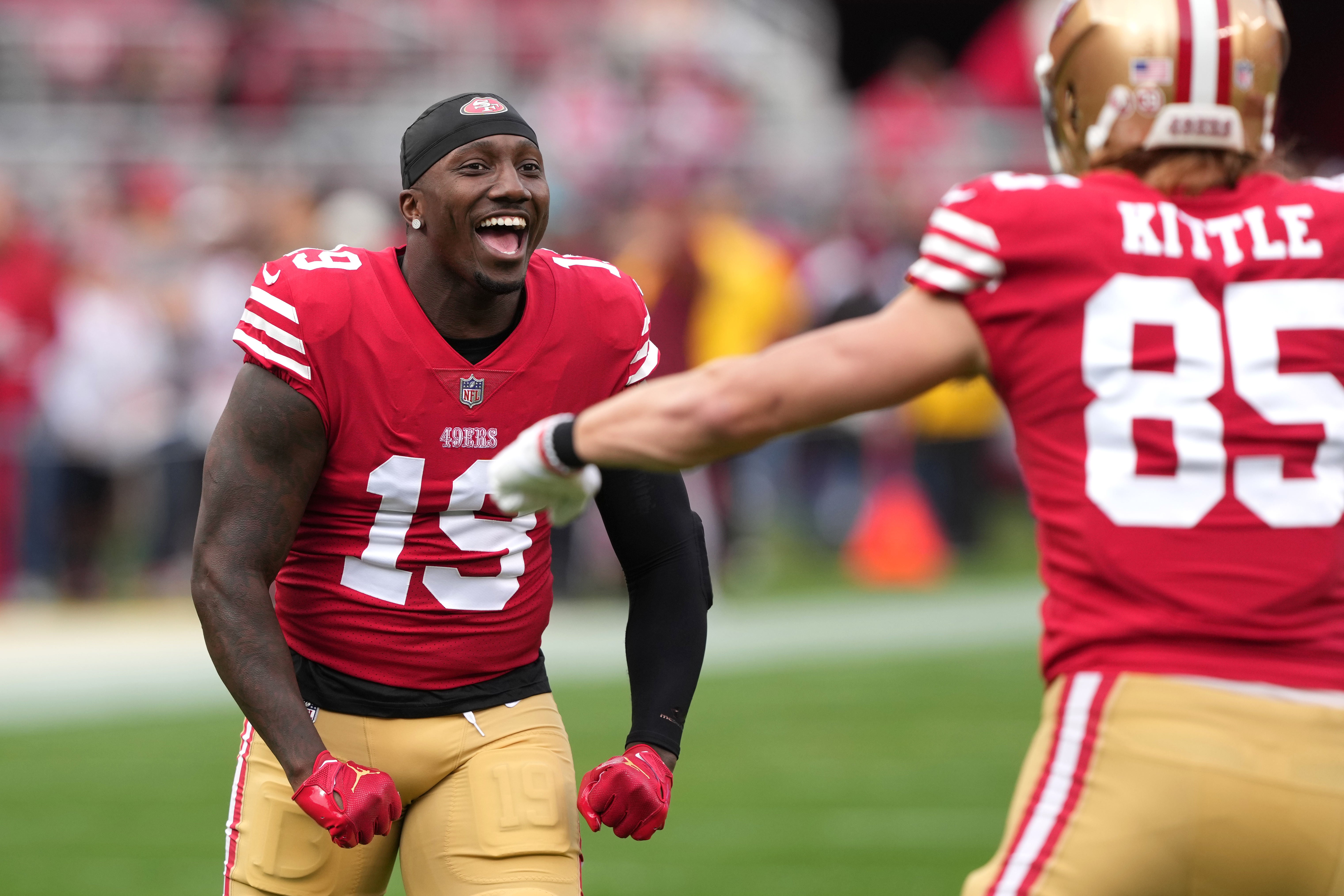Jan 8, 2023; Santa Clara, California, USA; San Francisco 49ers wide receiver Deebo Samuel (19) gestures with tight end George Kittle (85) before the game against the Arizona Cardinals at Levi's Stadium.