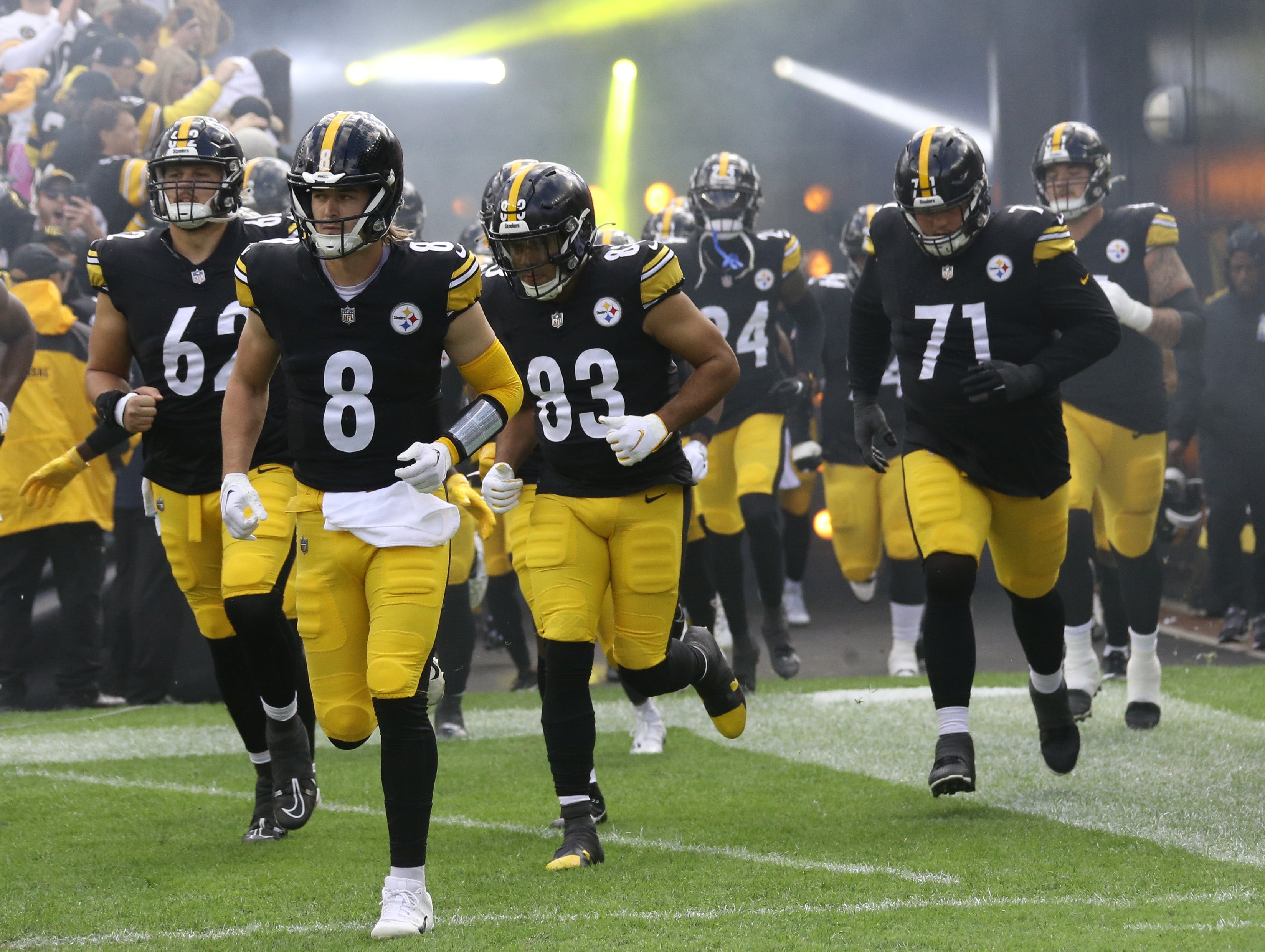 Oct 8, 2023; Pittsburgh, Pennsylvania, USA; The Pittsburgh Steelers including quarterback Kenny Pickett (8) and tight end Connor Heyward (83) and guard Nate Herbig (71) take the field against the Baltimore Ravens at Acrisure Stadium. Mandatory Credit: Charles LeClaire-USA TODAY Sports