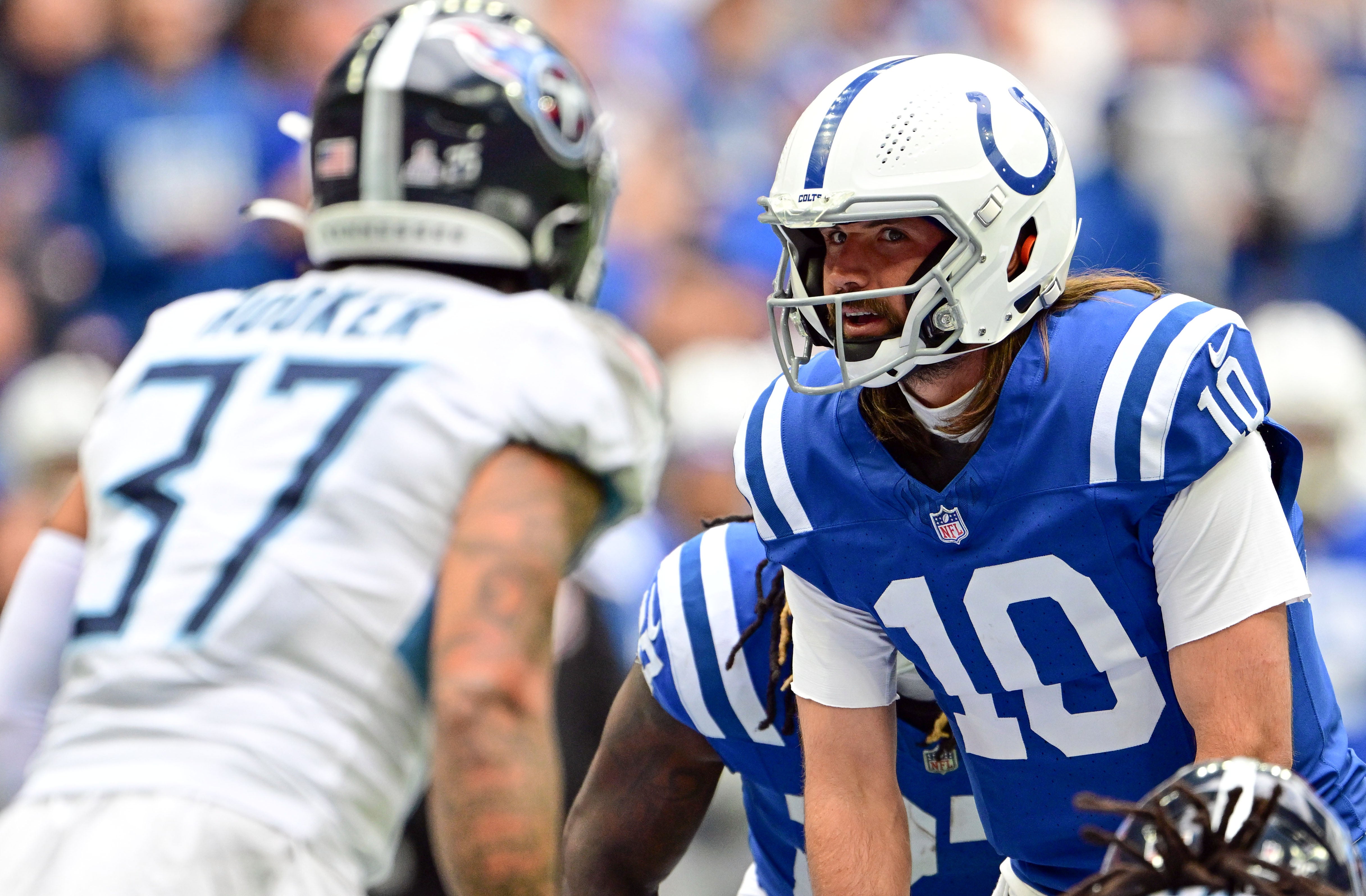 Oct 8, 2023; Indianapolis, Indiana, USA; Indianapolis Colts quarterback Gardner Minshew (10) looks at Tennessee Titans safety Amani Hooker (37) before taking the snap during the second half at Lucas Oil Stadium.