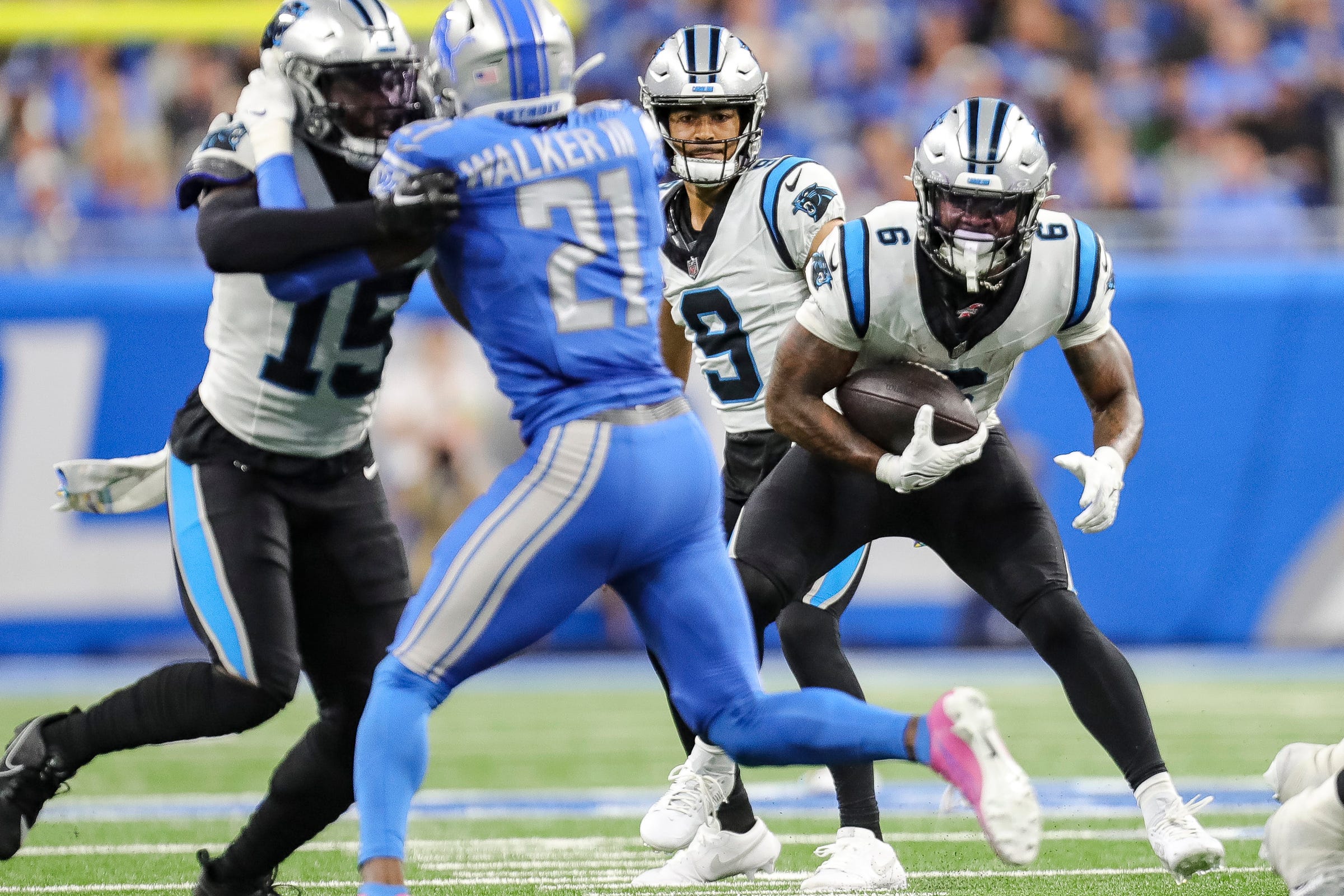 Carolina Panthers running back Miles Sanders mruns against Detroit Lions during the first half at Ford Field in Detroit on Sunday, Oct. 8, 2023.