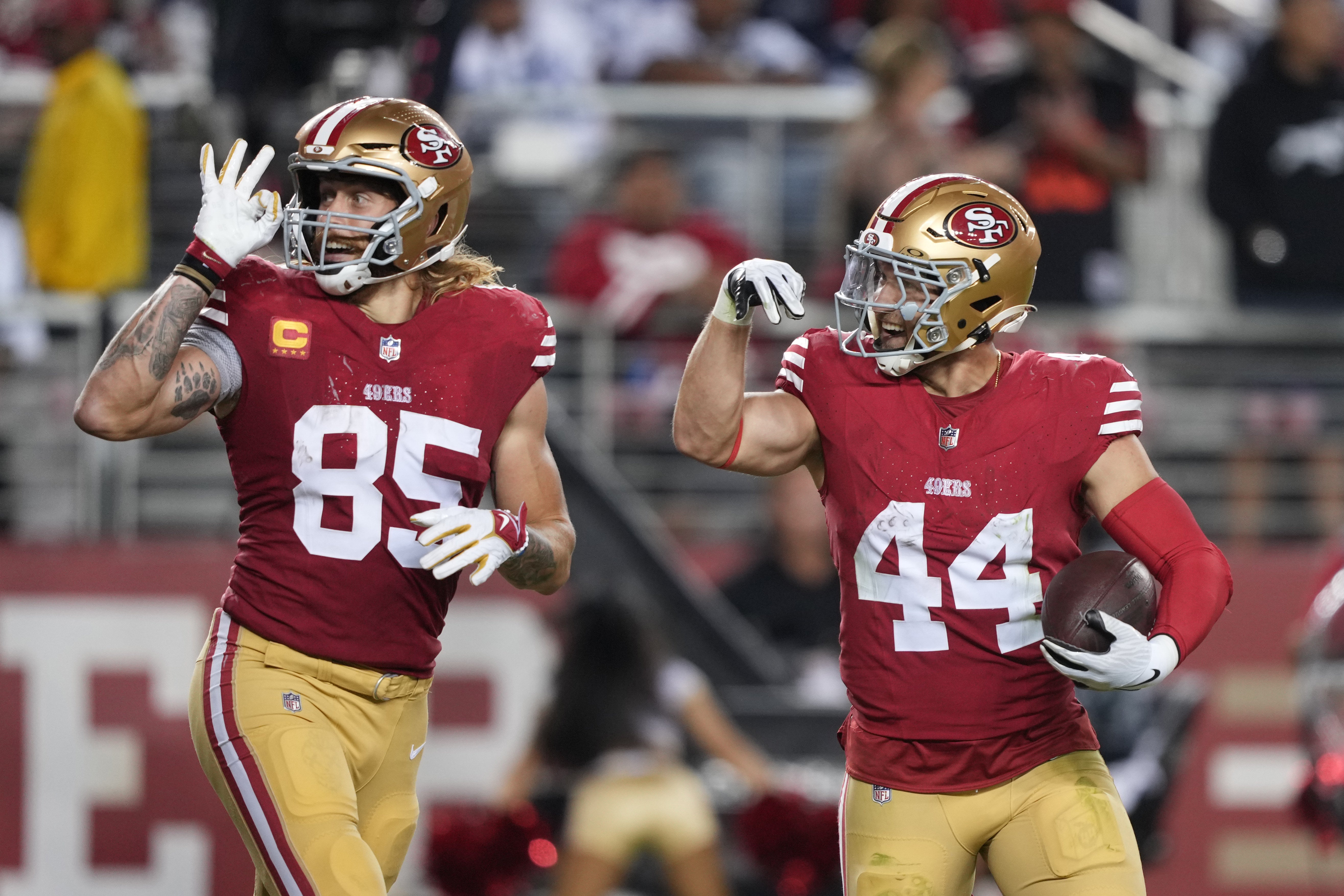 Oct 8, 2023; Santa Clara, California, USA; San Francisco 49ers tight end George Kittle (85) gestures with fullback Kyle Juszczyk (44) after scoring a touchdown against the Dallas Cowboys during the third quarter at Levi's Stadium.