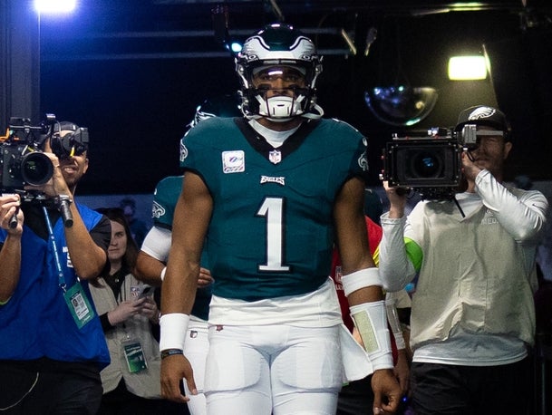 Eagles quarterback Jalen Hurts walks out out the tunnel.