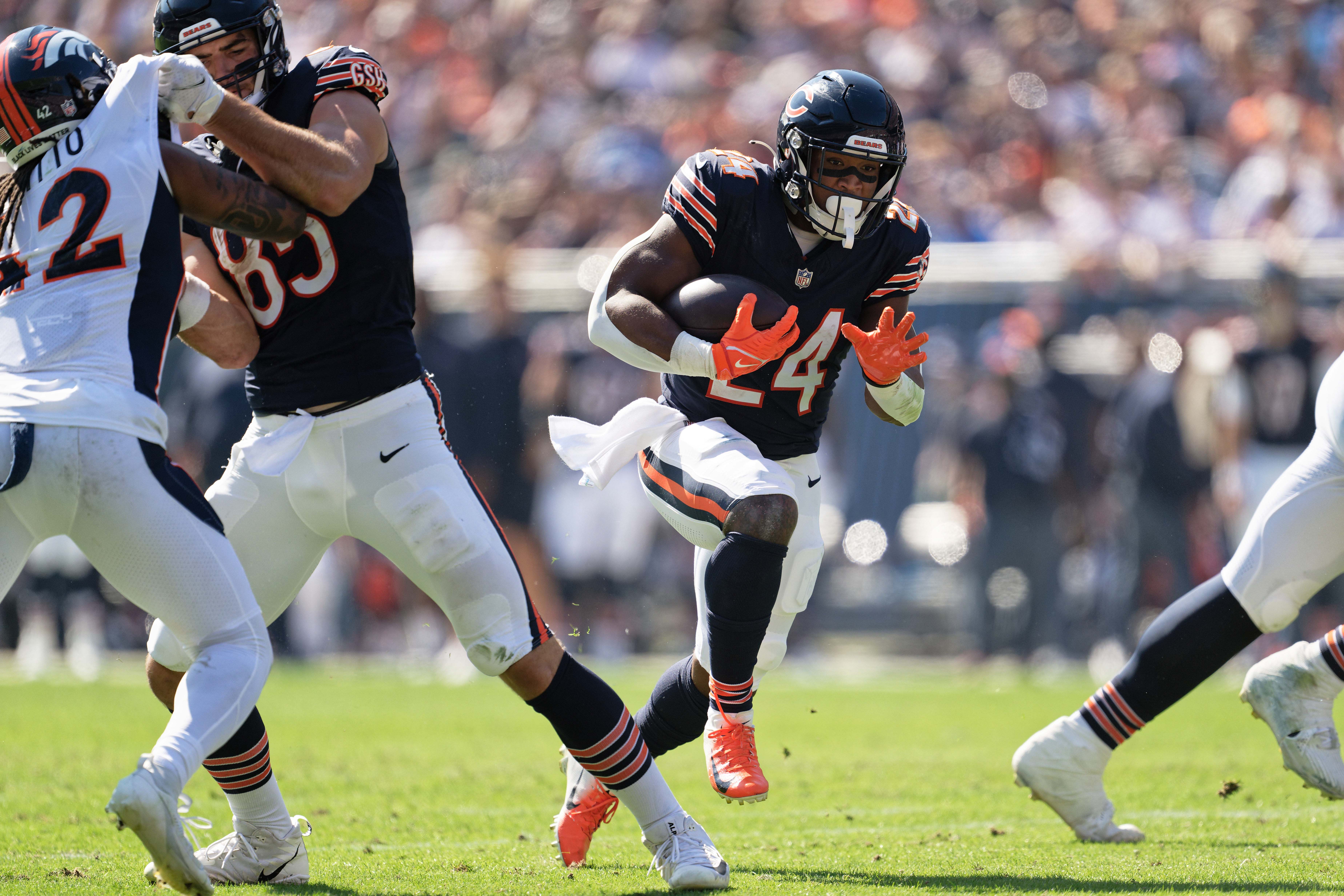 Oct 1, 2023; Chicago, Illinois, USA; Chicago Bears running back Khalil Herbert (24) runs with the ball against the Denver Broncos at Soldier Field.
