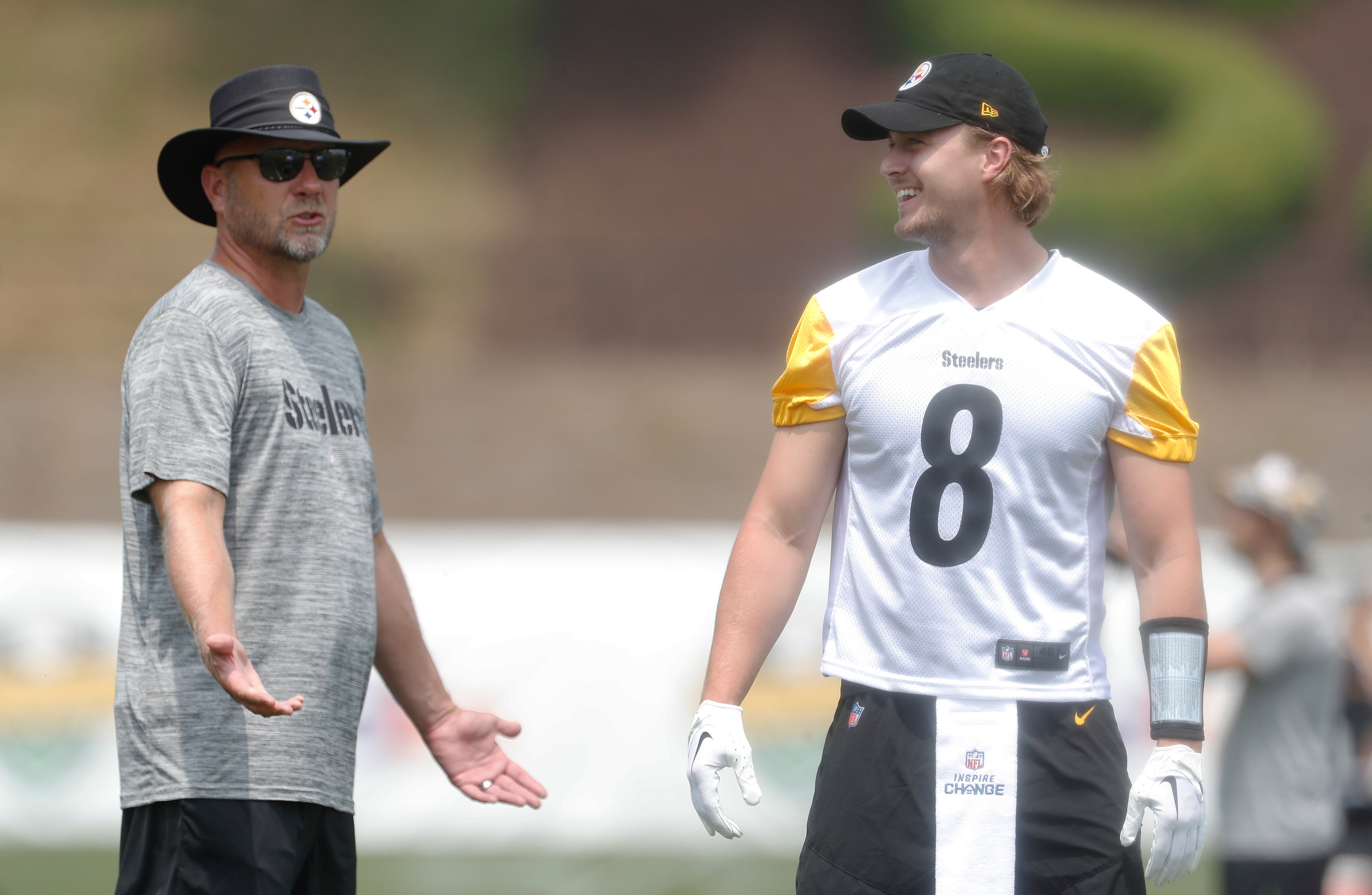 Jul 27, 2023; Latrobe, PA, USA; Pittsburgh Steelers offensive coordinator Matt Canada (left) instructs quarterback Kenny Pickett (8) in drills during training camp at Saint Vincent College. Mandatory Credit: Charles LeClaire-USA TODAY Sports