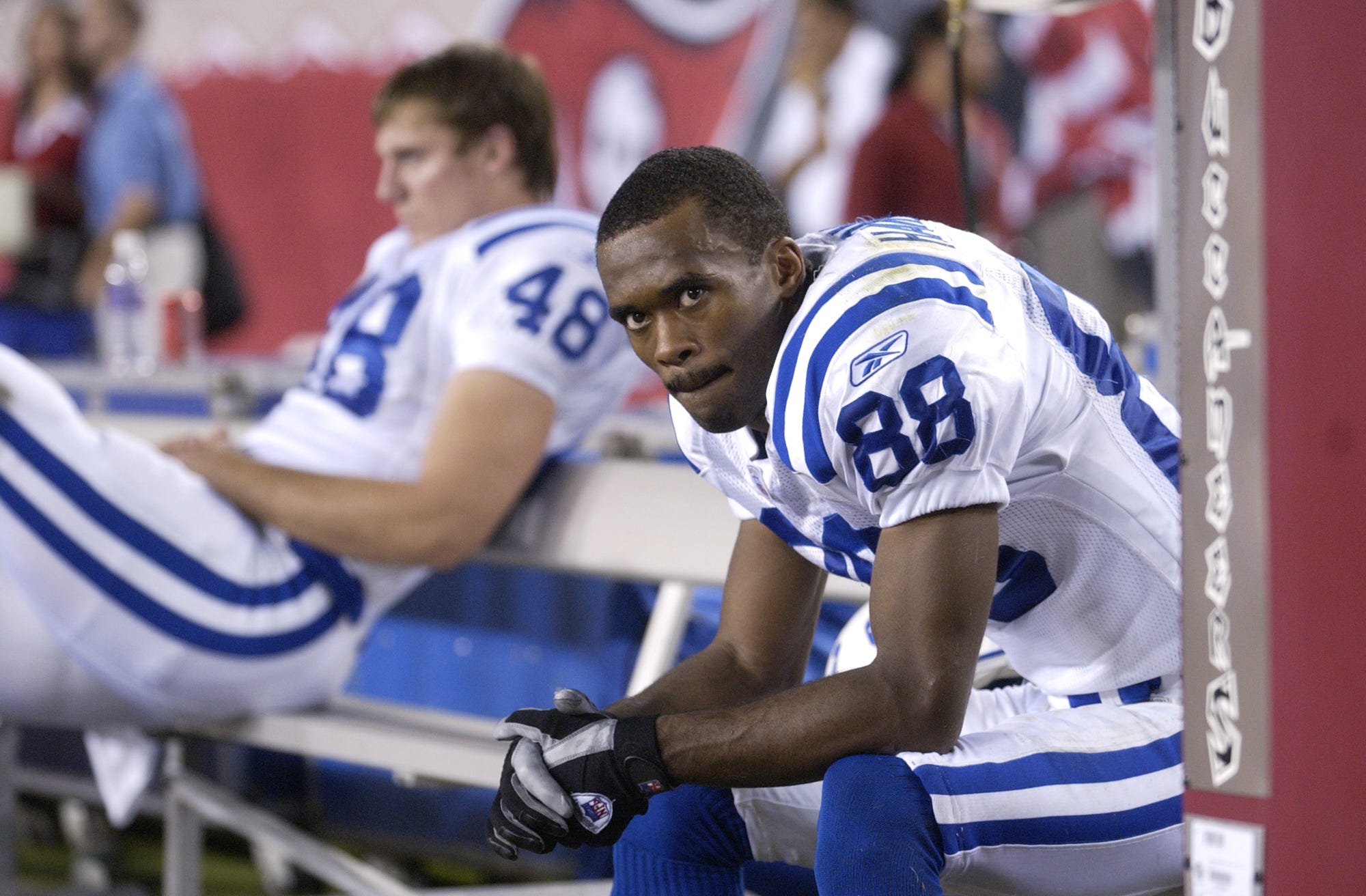 10-5-2003 Marvin Harrison foreground and teammate Justin Snow ride the bench during second-half action against the Bucs.