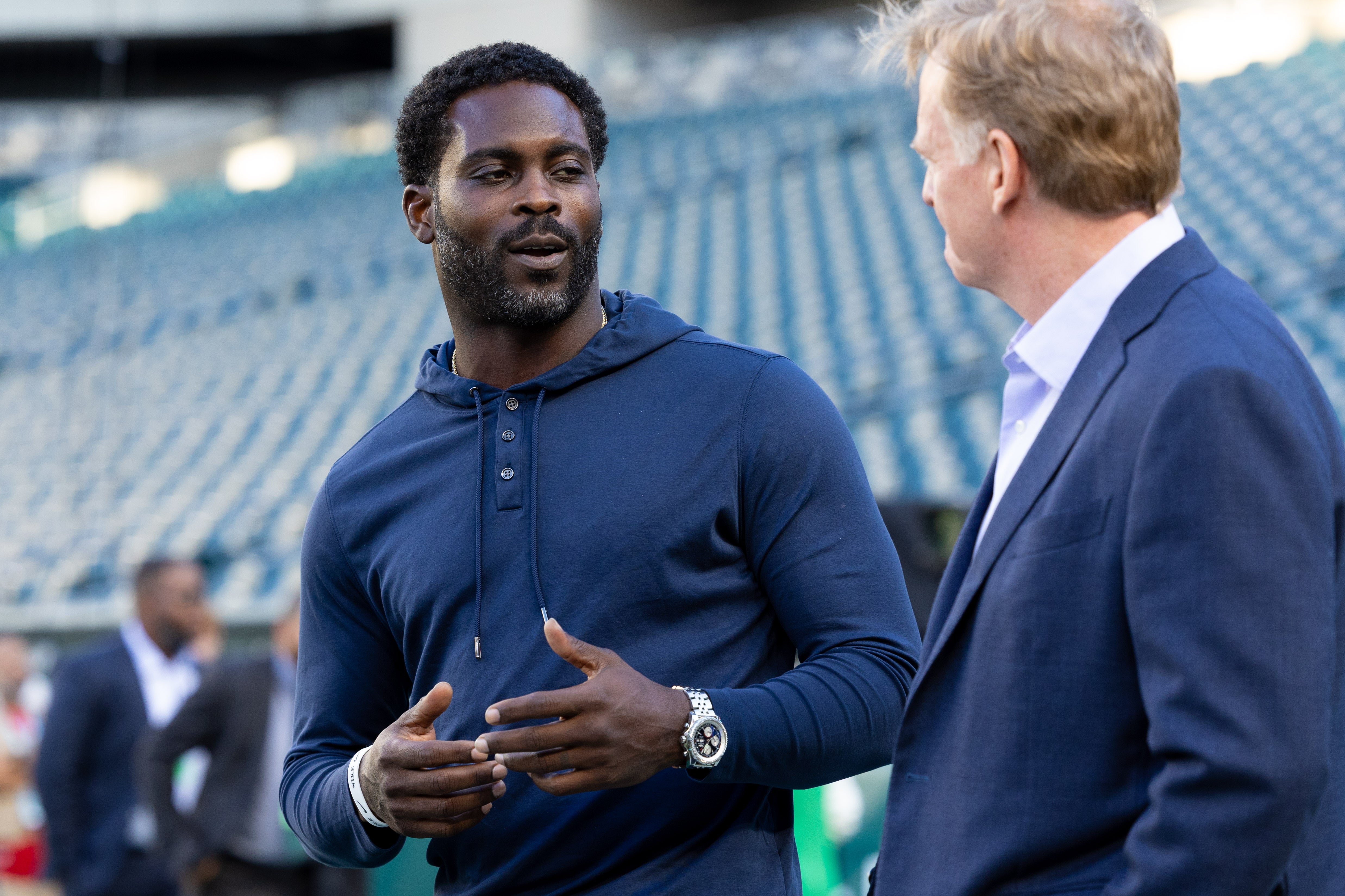 Sep 14, 2023; Philadelphia, Pennsylvania, USA; NFL commissioner Roger Goodell (R) talks with former player Michael Vick (L) before a game between the Philadelphia Eagles and the Minnesota Vikings at Lincoln Financial Field.