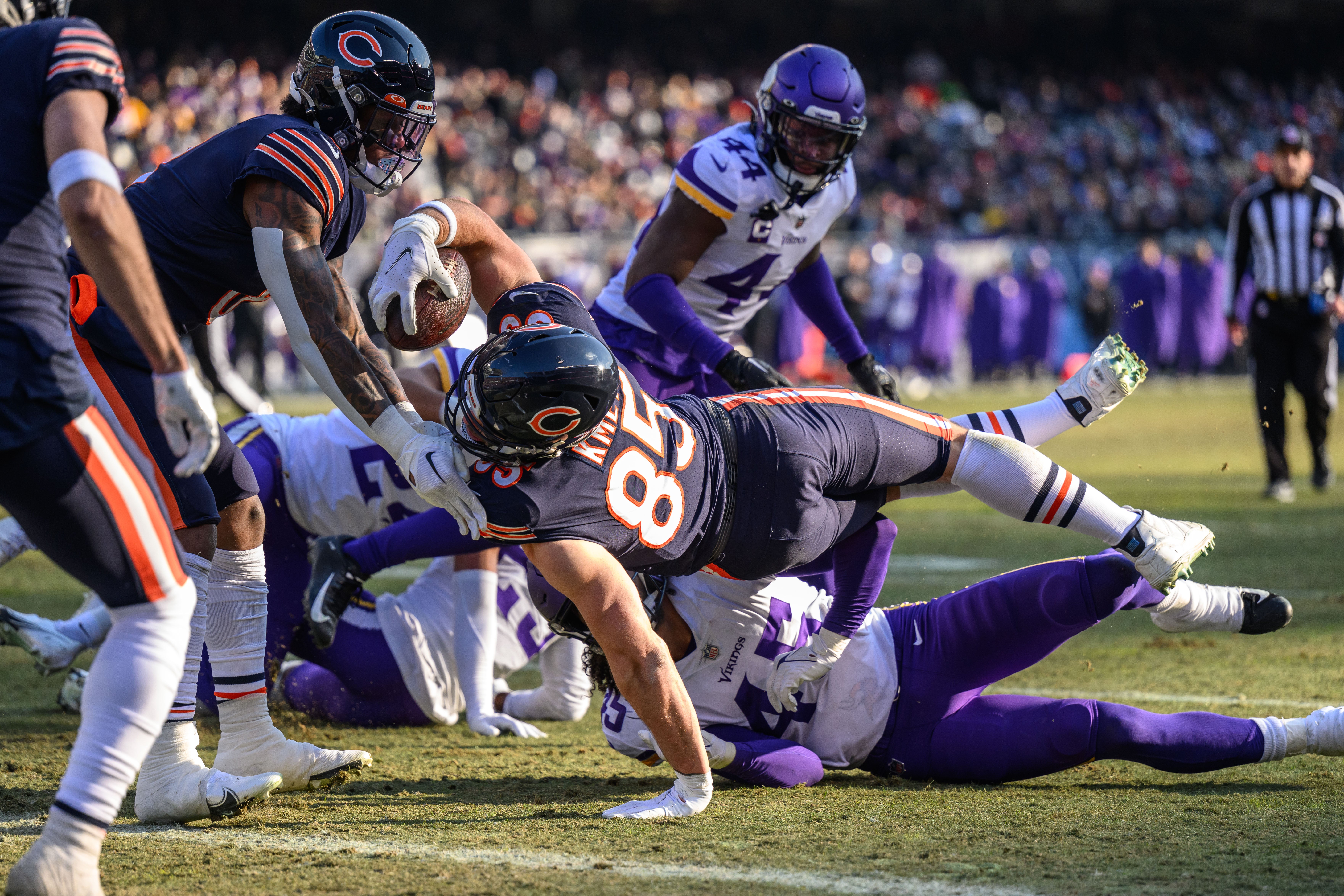 Jan 8, 2023; Chicago, Illinois, USA; Chicago Bears tight end Cole Kmet (85) dives into the end zone for a touchdown after a reception during the third quarter against the Minnesota Vikings at Soldier Field.