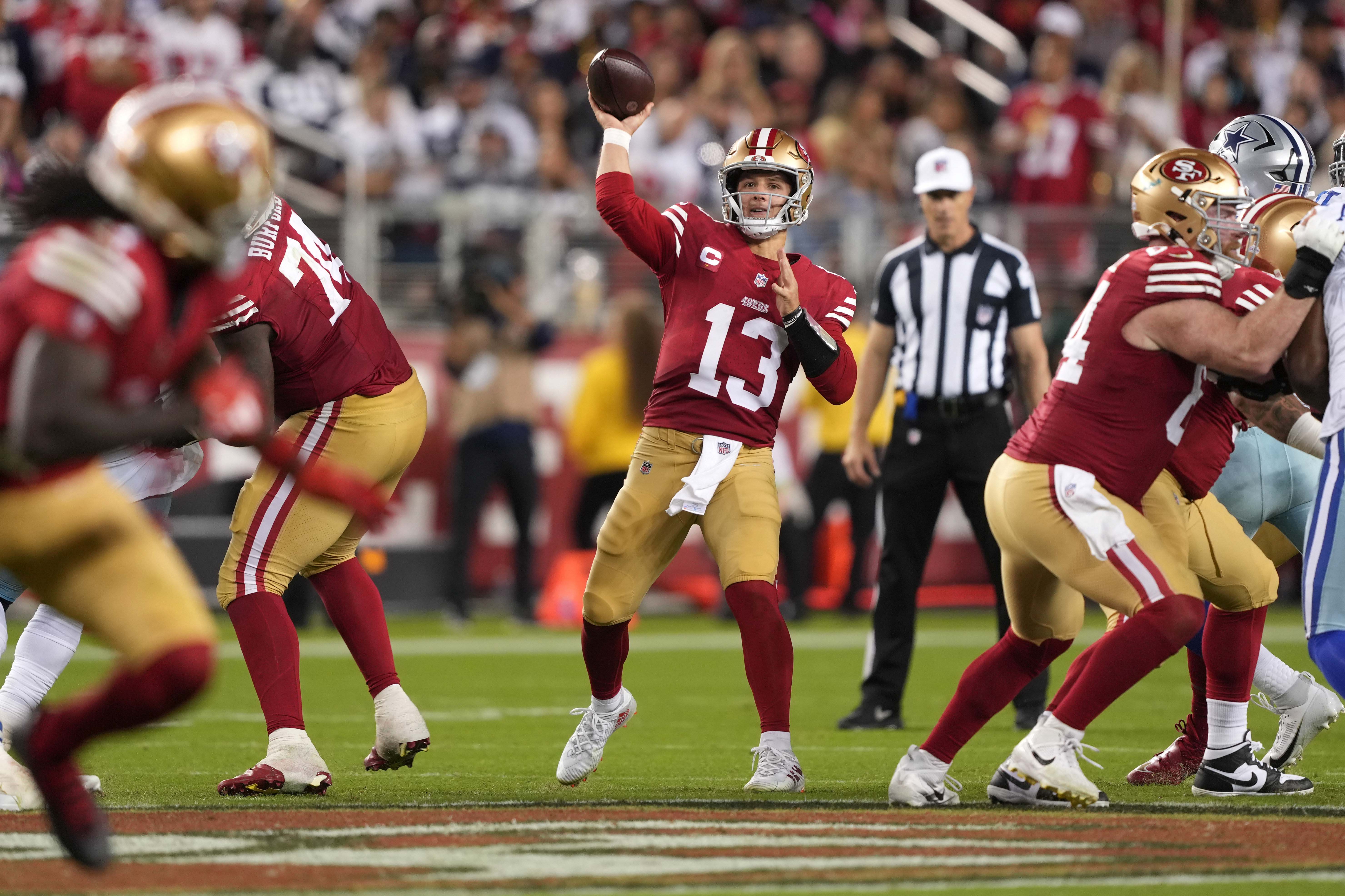Oct 8, 2023; Santa Clara, California, USA; San Francisco 49ers quarterback Brock Purdy (13) throws a pass against the Dallas Cowboys during the third quarter at Levi's Stadium.