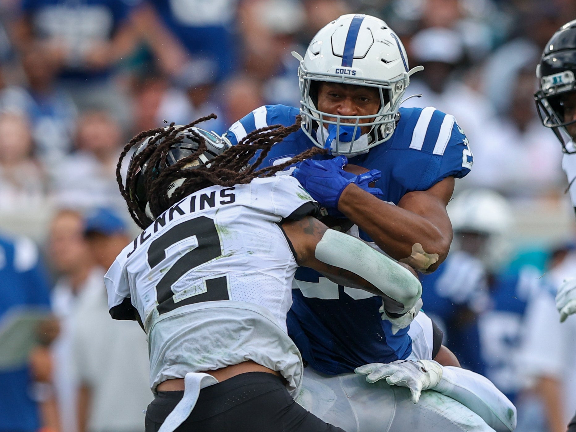 Sep 18, 2022; Jacksonville, Florida, USA; Indianapolis Colts running back Jonathan Taylor (28) is tackled by Jacksonville Jaguars safety Rayshawn Jenkins (2) in the fourth quarter at TIAA Bank Field.