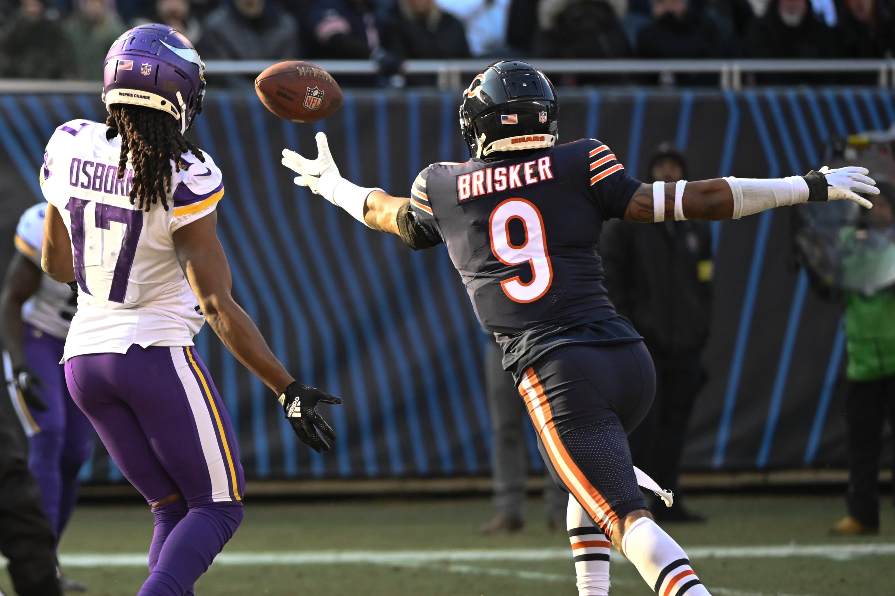 Jan 8, 2023; Chicago, Illinois, USA; Chicago Bears safety Jaquan Brisker (9) breaks up a pass intended for Minnesota Vikings wide receiver K.J. Osborn (17) during the second half at Soldier Field.