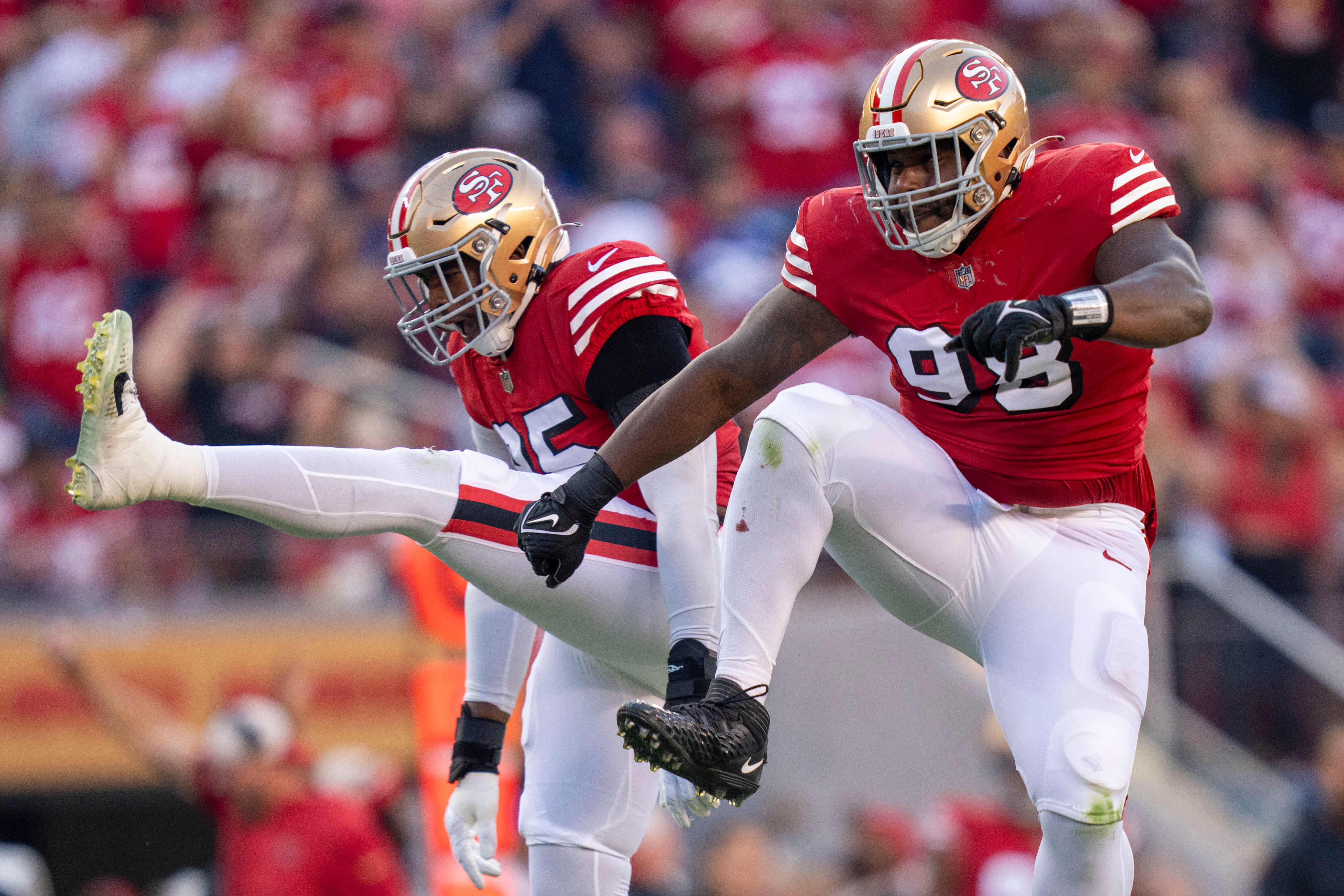 September 21, 2023; Santa Clara, California, USA; San Francisco 49ers defensive tackle Javon Hargrave (98, right) and defensive end Drake Jackson (95, left) celebrate a defensive stop against the New York Giants during the second quarter at Levi's Stadium.