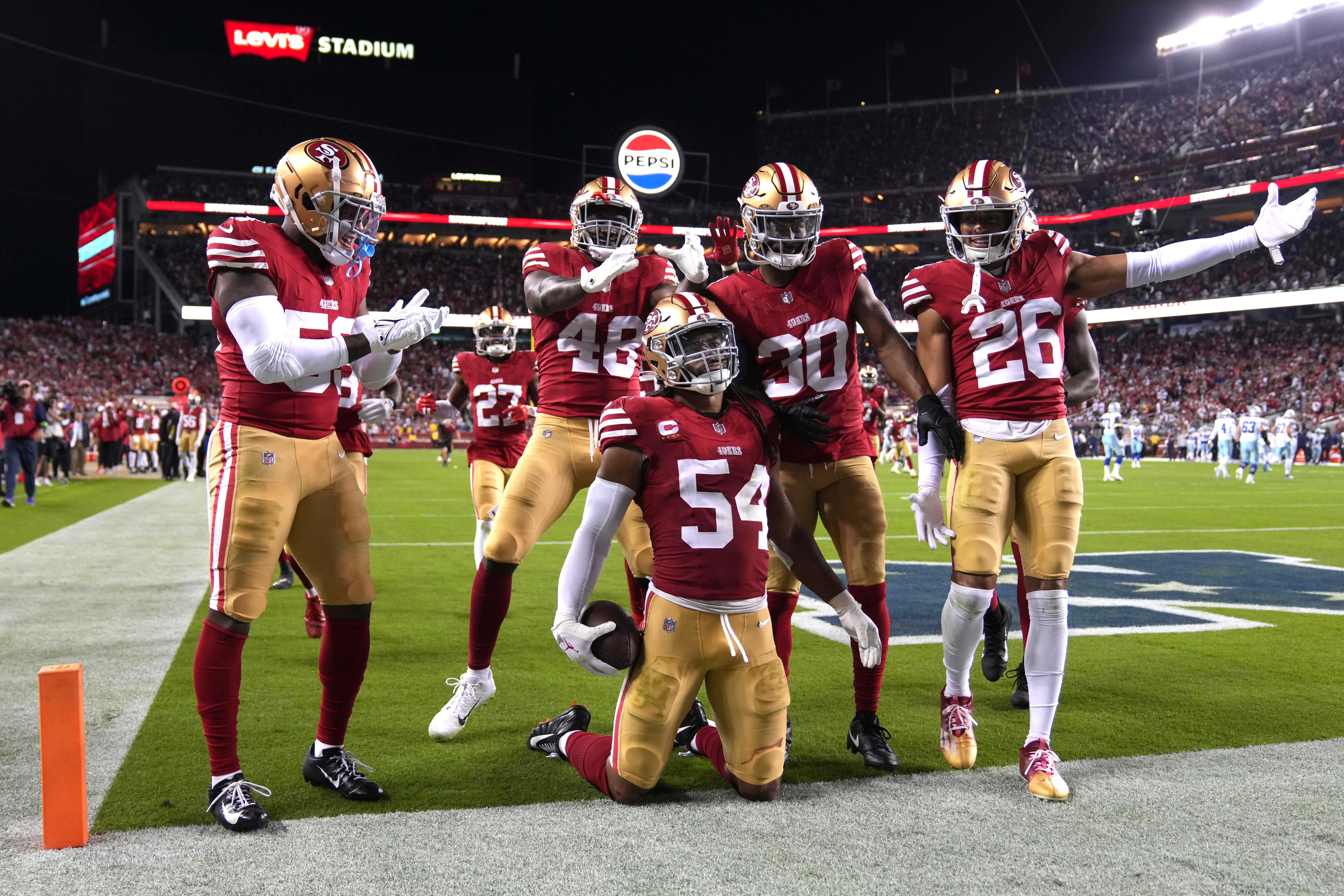 Oct 8, 2023; Santa Clara, California, USA; San Francisco 49ers linebacker Fred Warner (54) poses with teammates after intercepting a pass against the Dallas Cowboys during the fourth quarter at Levi's Stadium.