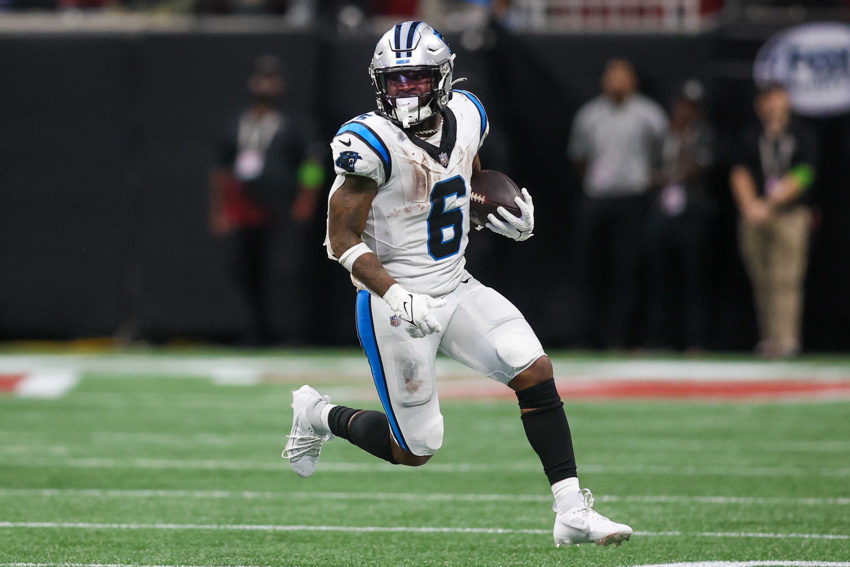 Sep 10, 2023; Atlanta, Georgia, USA; Carolina Panthers running back Miles Sanders (6) runs the ball against the Atlanta Falcons in the second half at Mercedes-Benz Stadium. Mandatory Credit: Brett Davis-USA TODAY Sports