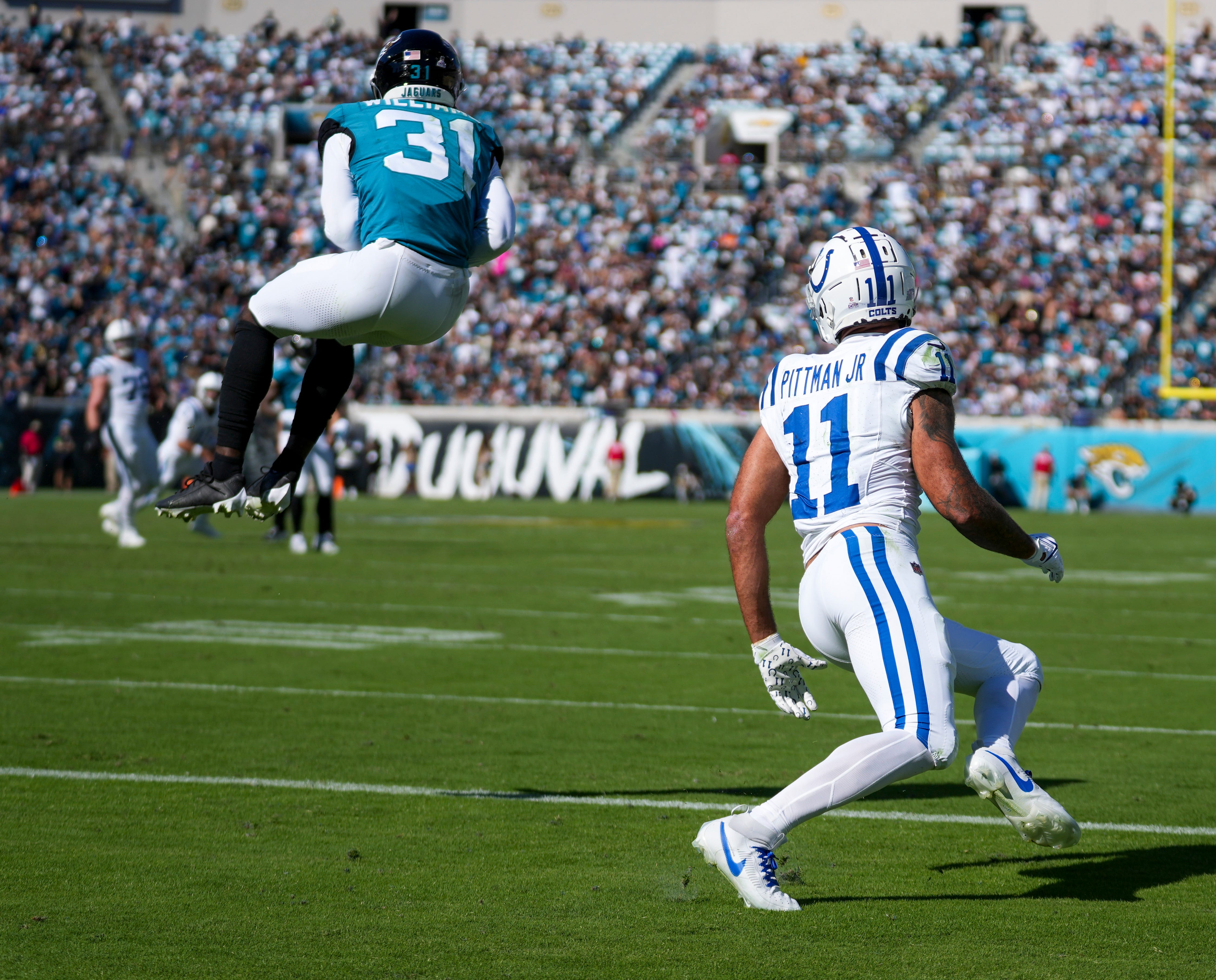 Jacksonville Jaguars cornerback Darious Williams (31) nabs an interception as Indianapolis Colts wide receiver Michael Pittman Jr. (11) waits in the end zone during game action at EverBank Stadium on Sunday, Oct 15, 2023, in Jacksonville.