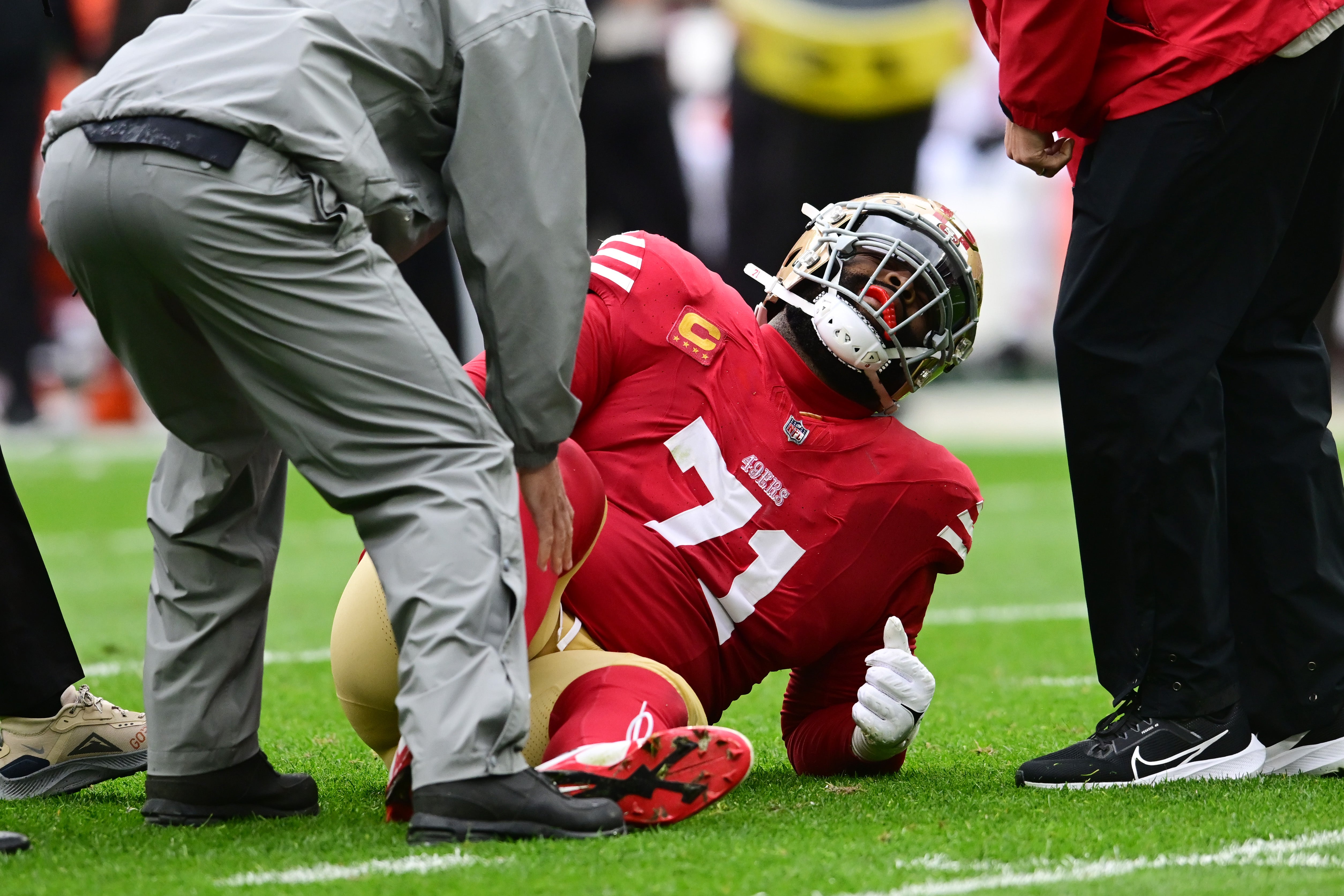 Oct 15, 2023; Cleveland, Ohio, USA; San Francisco 49ers offensive tackle Trent Williams (71) is looked at by trainers during the first half against the Cleveland Browns at Cleveland Browns Stadium.