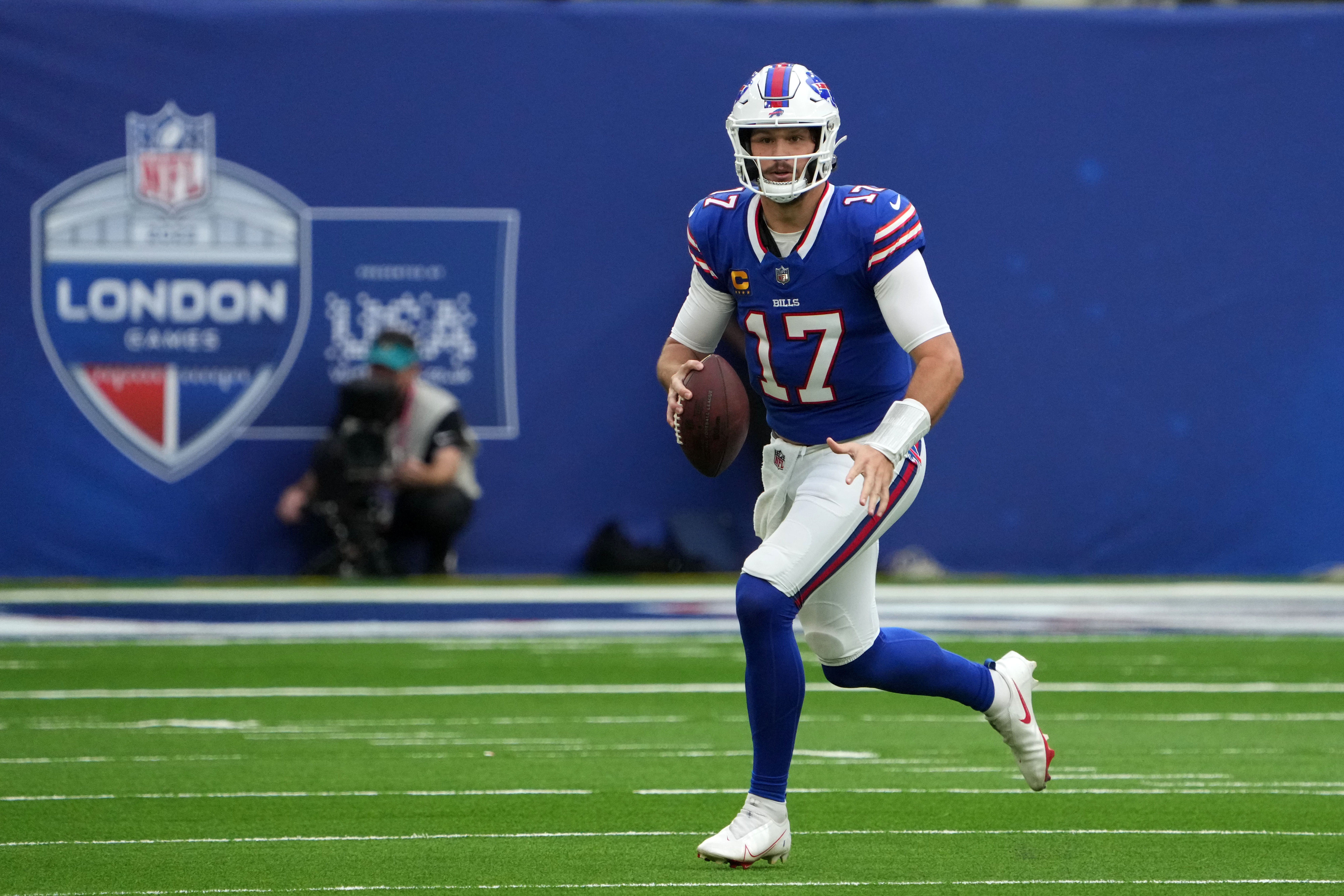 Buffalo Bills QB Josh Allen scrambling out of the pocket during a game against the Jacksonville Jaguars