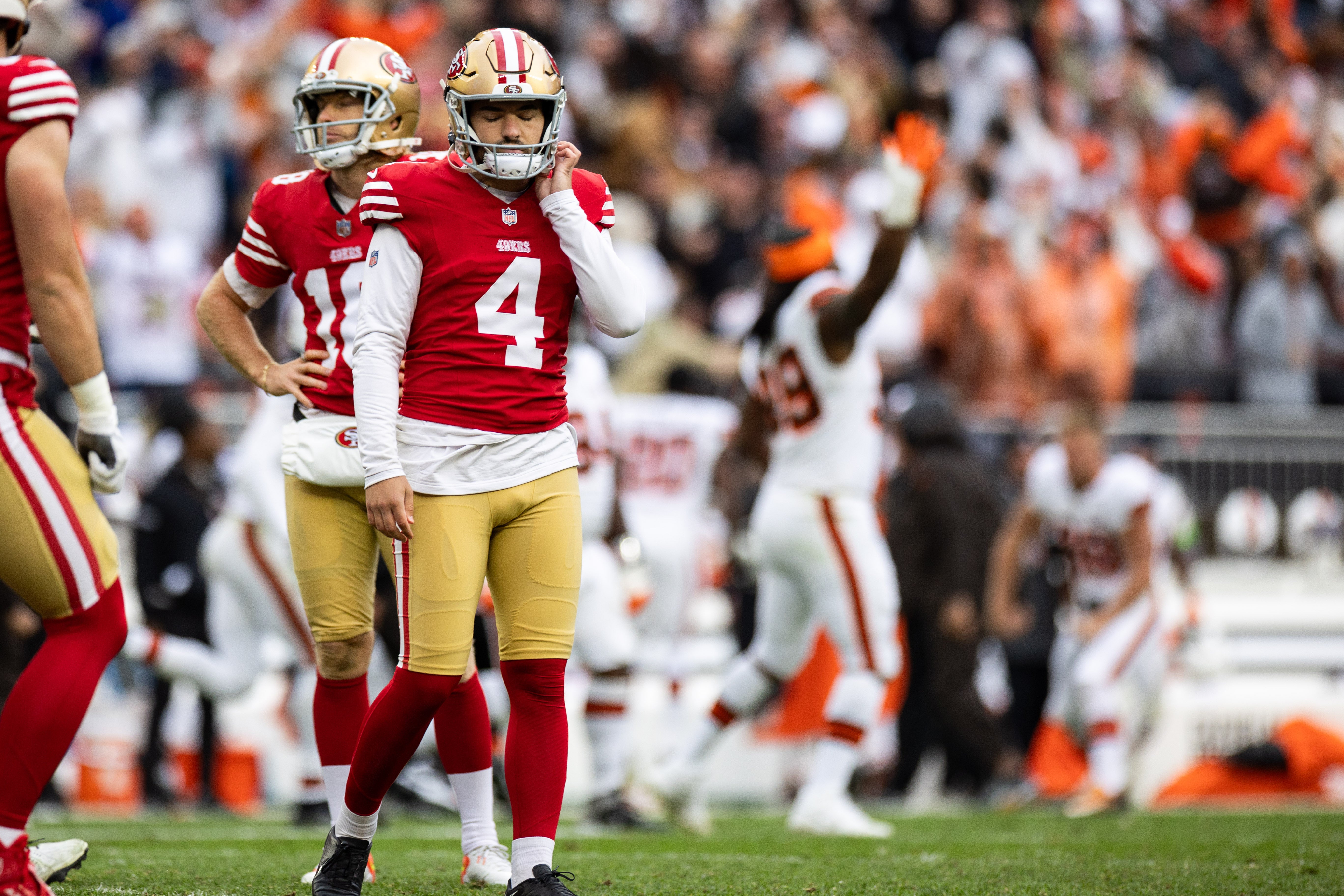 Oct 15, 2023; Cleveland, Ohio, USA; San Francisco 49ers place kicker Jake Moody (4) unbuckles his helmet after missing a field goal against the Cleveland Browns with six seconds left on the game clock during the fourth quarter at Cleveland Browns Stadium.