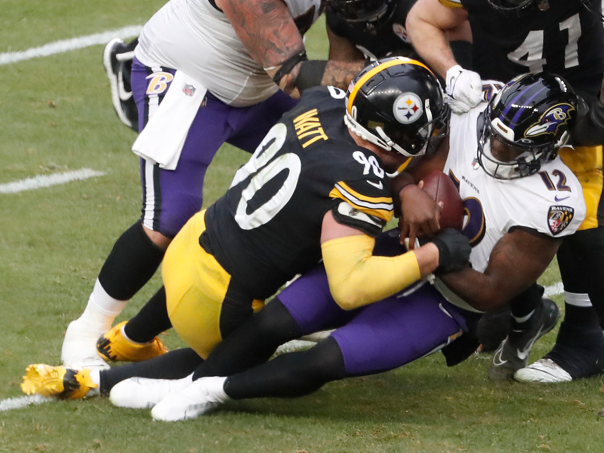 Dec 11, 2022; Pittsburgh, Pennsylvania, USA; Pittsburgh Steelers linebacker T.J. Watt (90) sacks Baltimore Ravens quarterback Anthony Brown (12) during the third quarter at Acrisure Stadium.Baltimore won 16-14. Mandatory Credit: Charles LeClaire-USA TODAY Sports