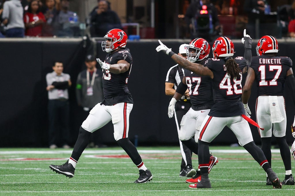 Falcons' defensive end Calais Campbell celebrates his 100th sack.