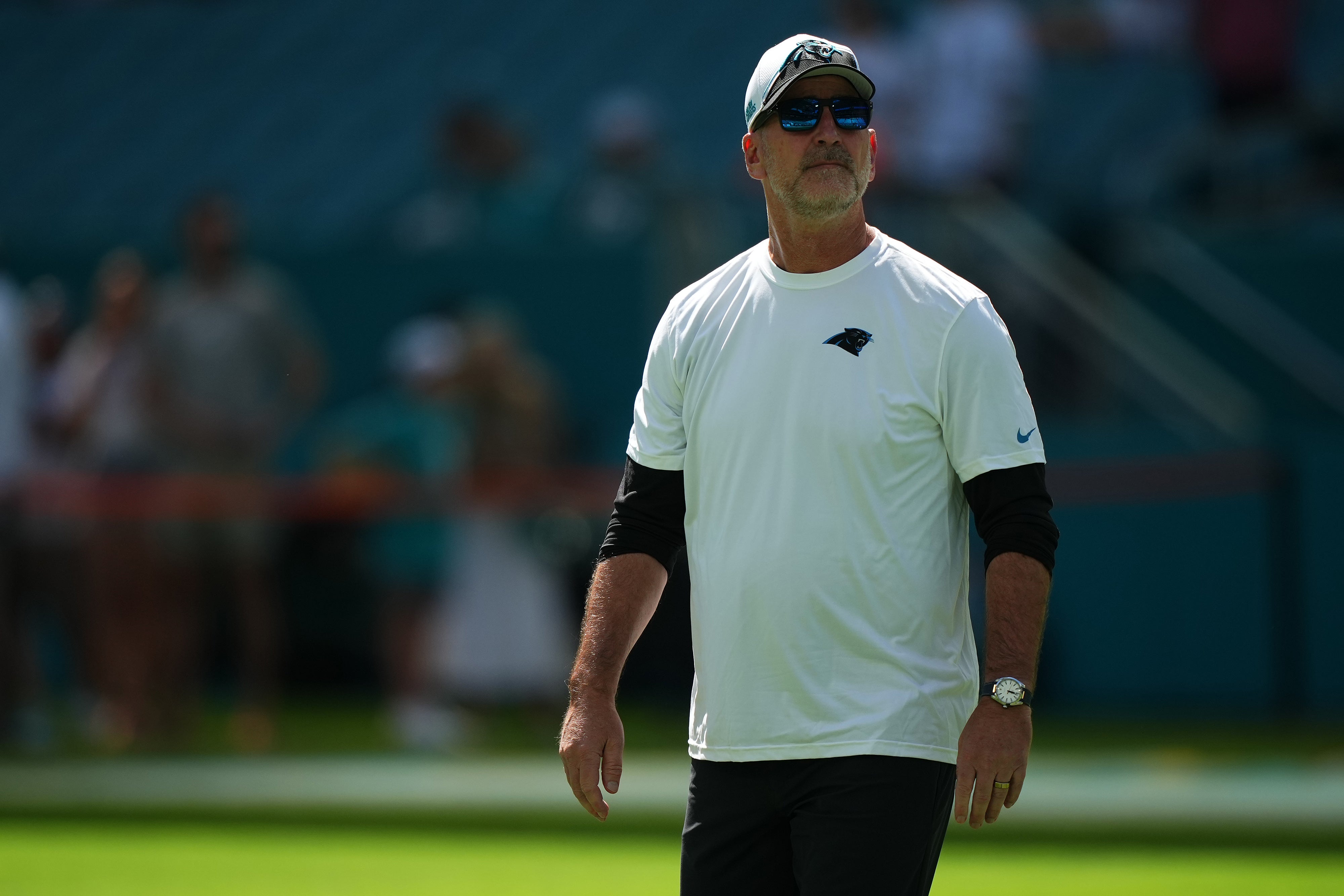 Oct 15, 2023; Miami Gardens, Florida, USA; Carolina Panthers head coach Frank Reich walks on the field prior to the game against the Miami Dophins at Hard Rock Stadium. Mandatory Credit: Jasen Vinlove-USA TODAY Sports