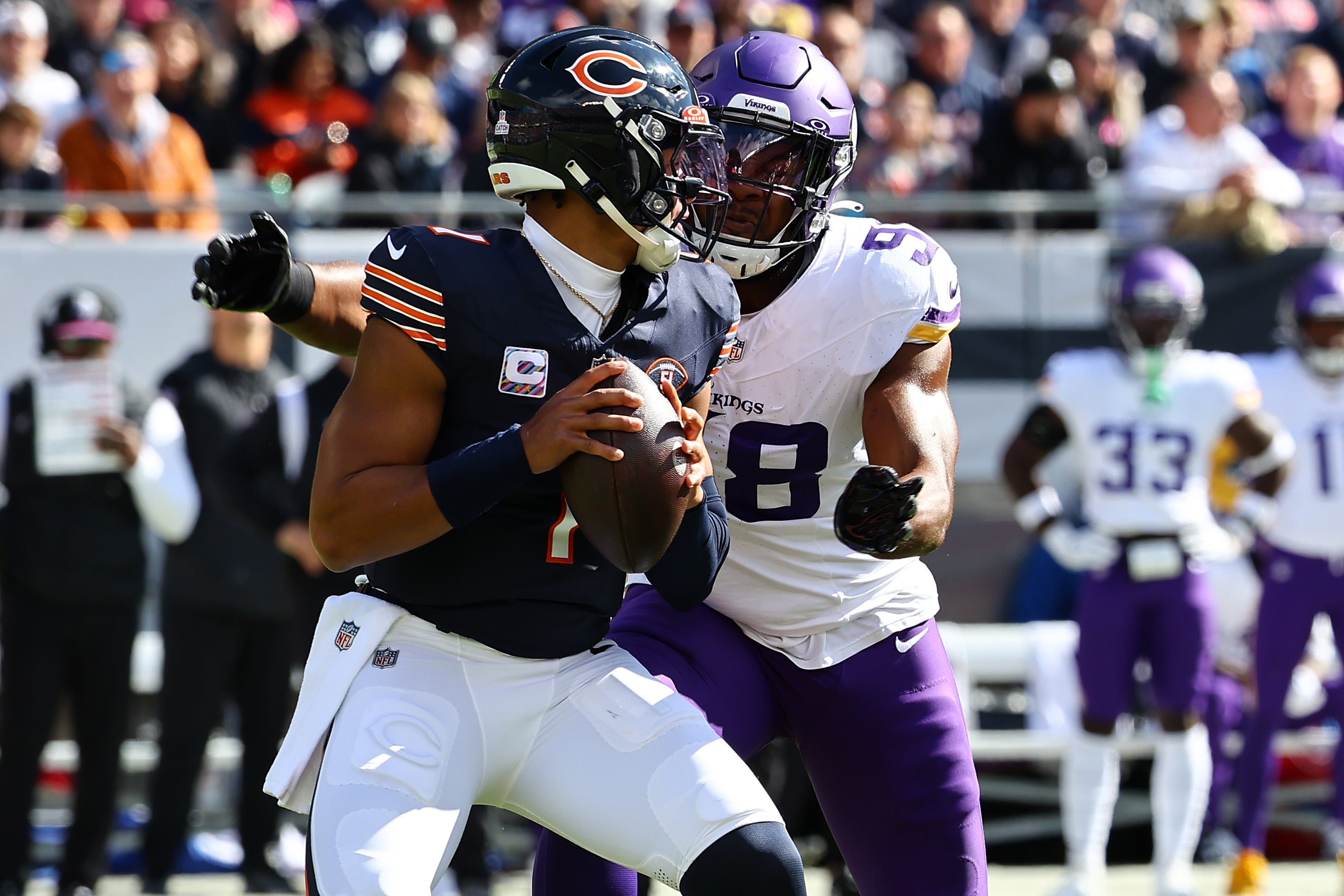 Oct 15, 2023; Chicago, Illinois, USA; Minnesota Vikings linebacker D.J. Wonnum (98) sacks Chicago Bears quarterback Justin Fields (1) during the first half at Soldier Field.