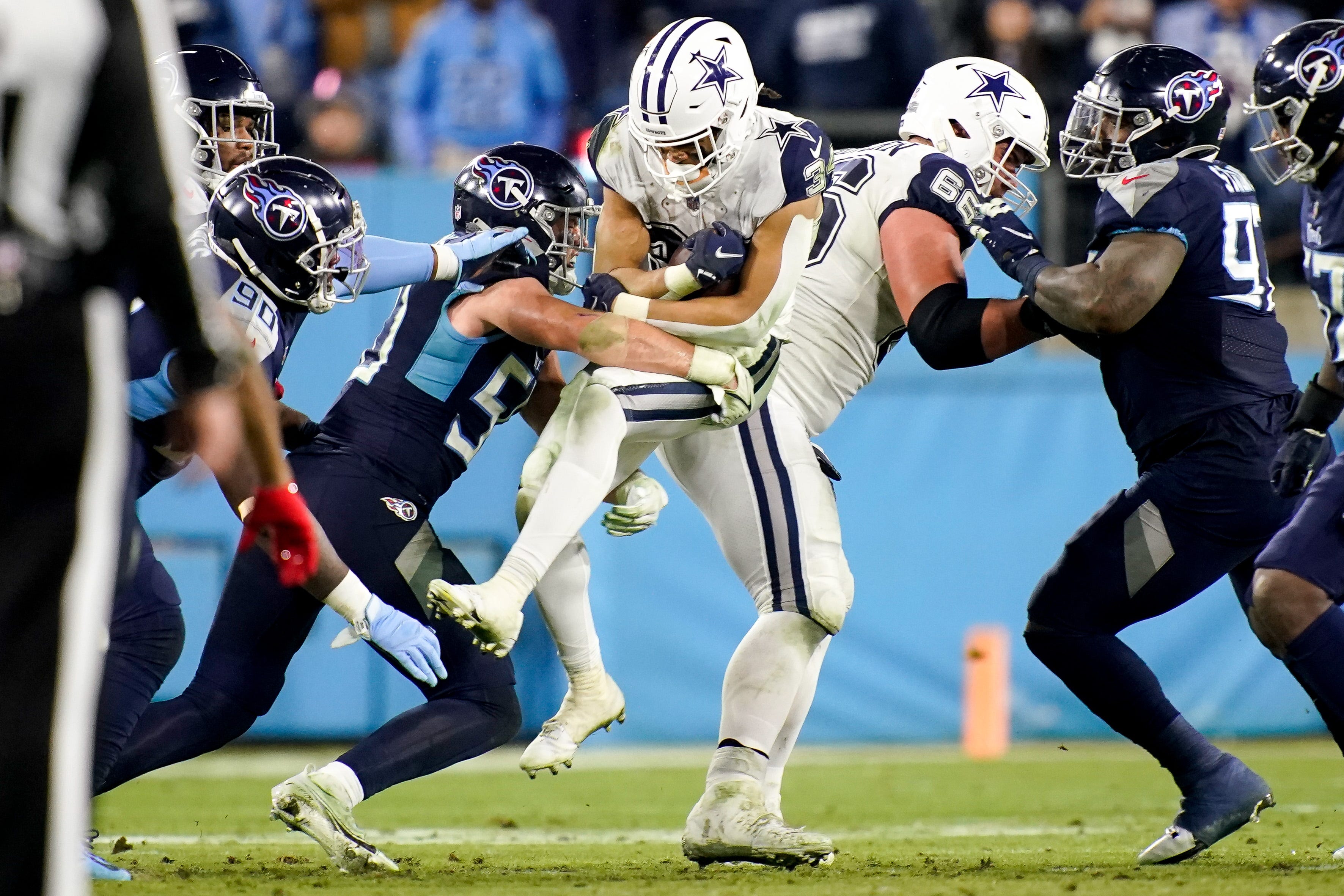 Dallas Cowboys running back Malik Davis (34) is brought down by Tennessee Titans linebacker Jack Gibbens (50) during the third quarter at Nissan Stadium Thursday, Dec. 29, 2022, in Nashville, Tenn. Nfl Dallas Cowboys At Tennessee Titans
