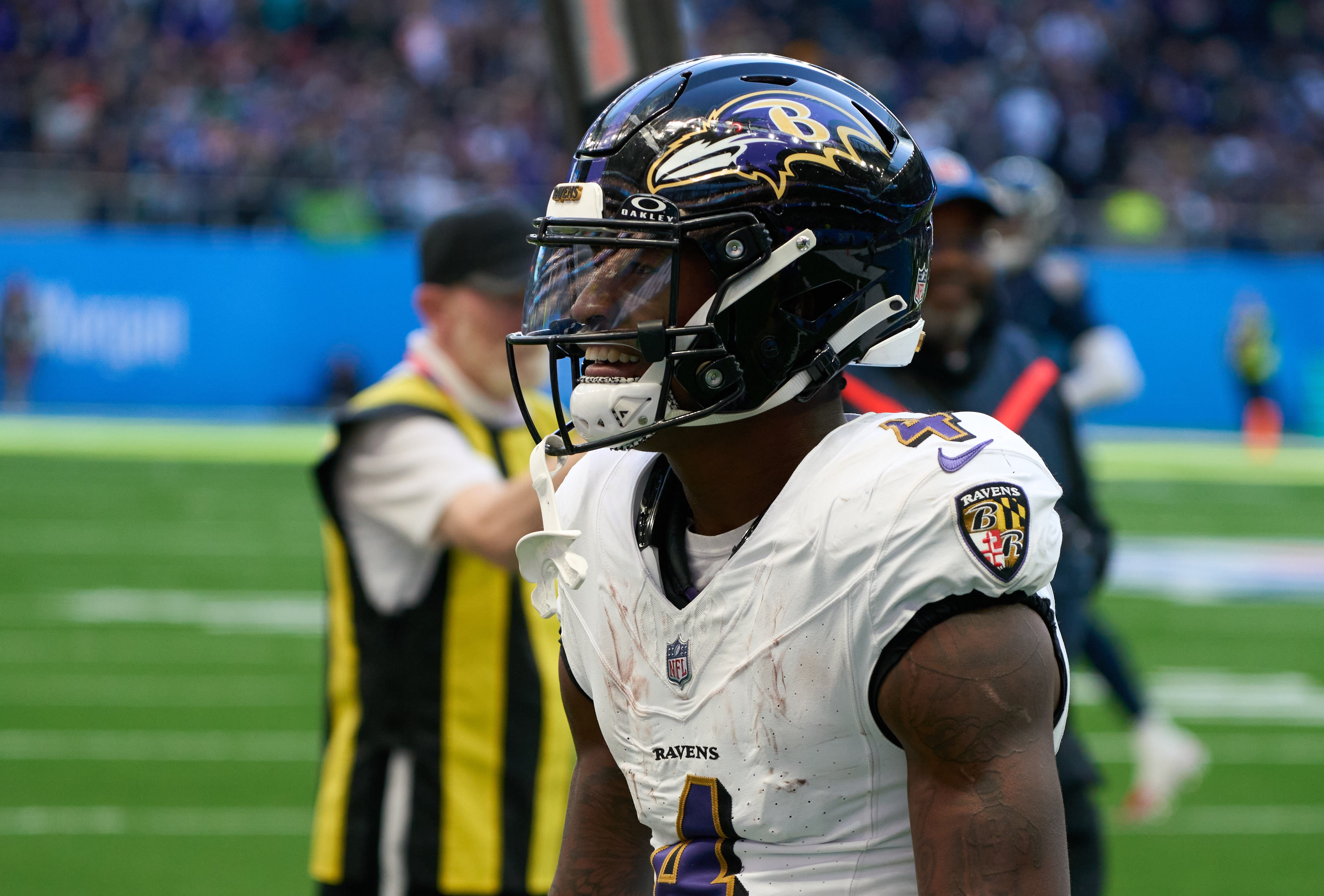 Baltimore Ravens wide receiver Zay Flowers (4) celebrates as he scores a touchdown during the first half of an NFL International Series game at Tottenham Hotspur Stadium.