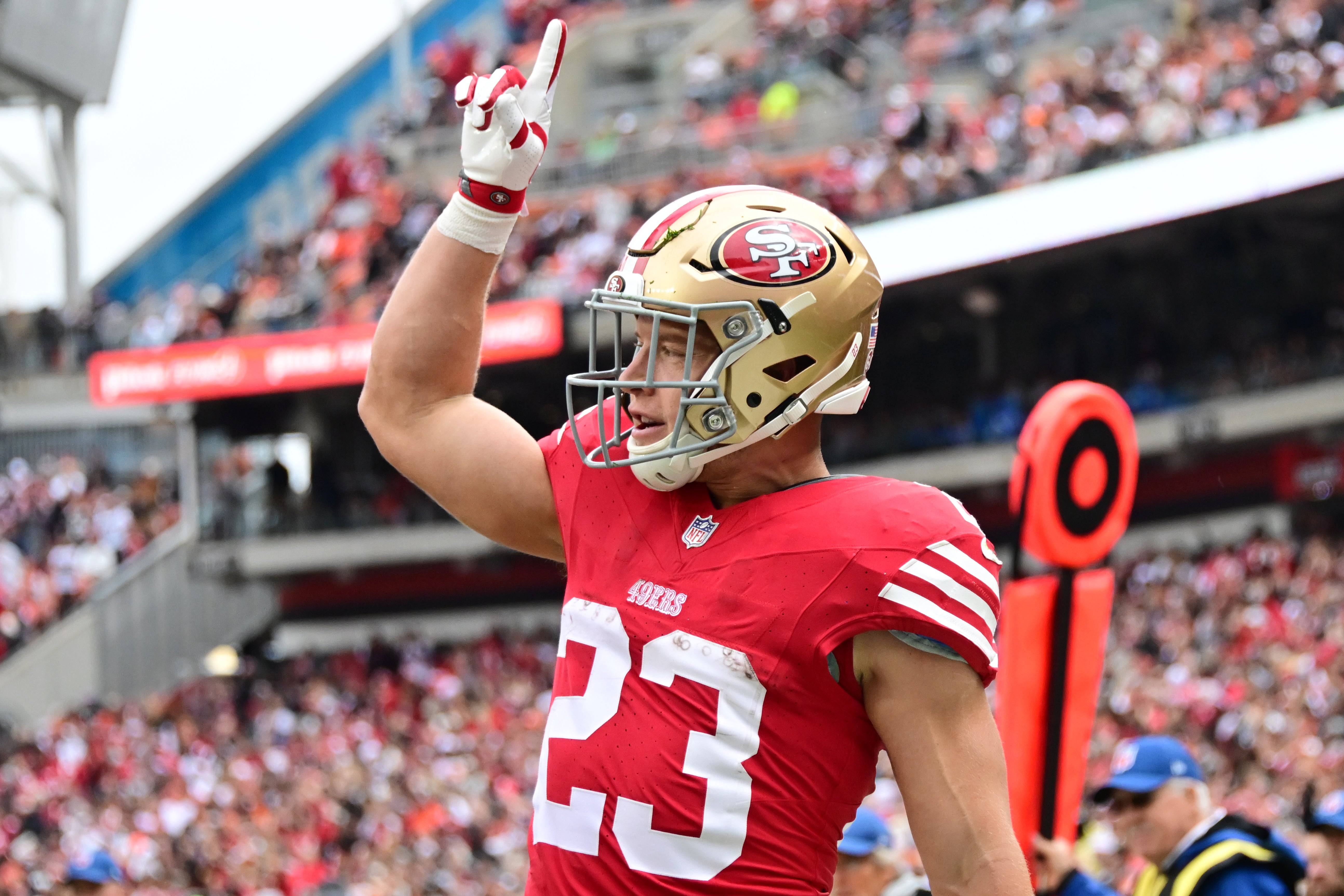 Oct 15, 2023; Cleveland, Ohio, USA; San Francisco 49ers running back Christian McCaffrey (23) celebrates after scoring during the first half against the Cleveland Browns at Cleveland Browns Stadium.