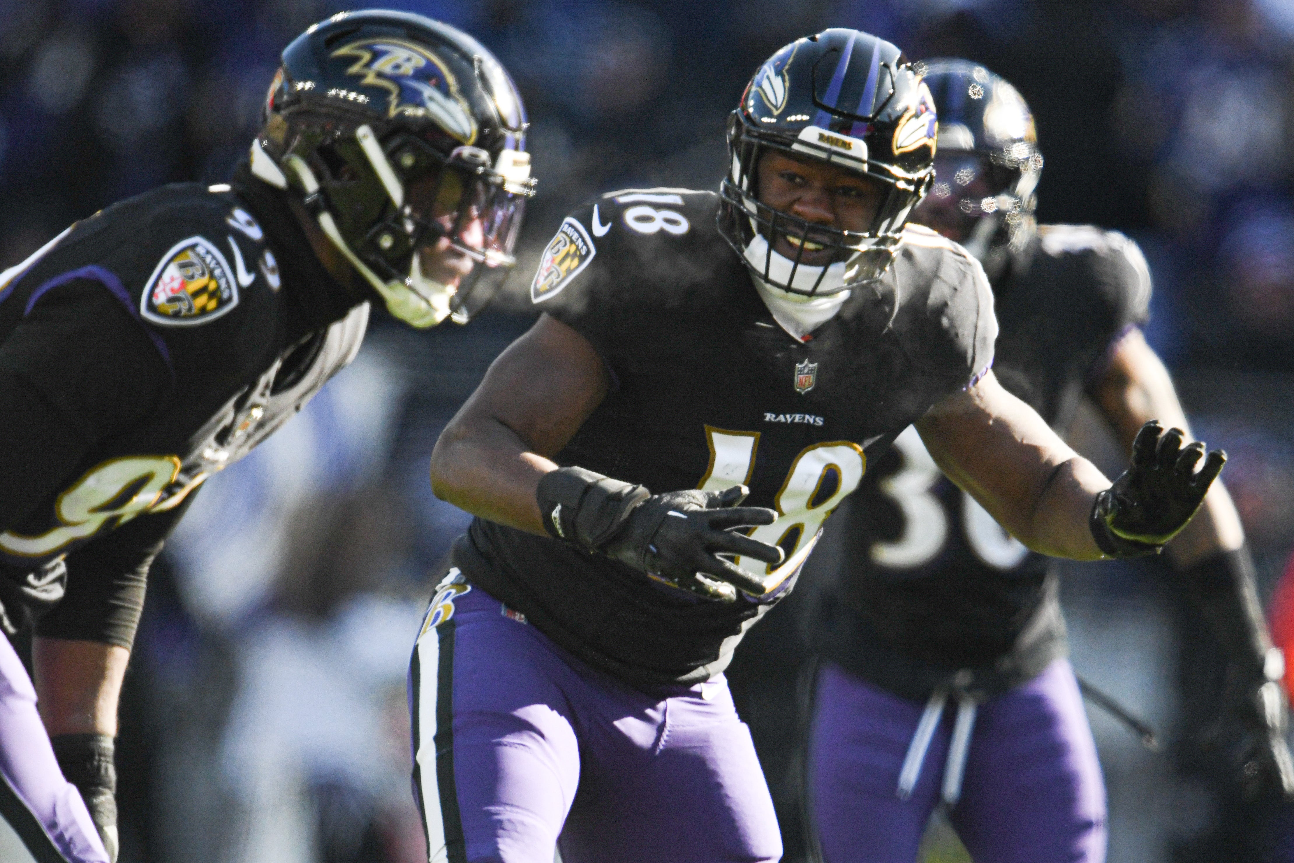 Baltimore Ravens linebacker Roquan Smith (18) directs linebacker Odafe Oweh (99) during the first half against the Atlanta Falcons at M&T Bank Stadium.