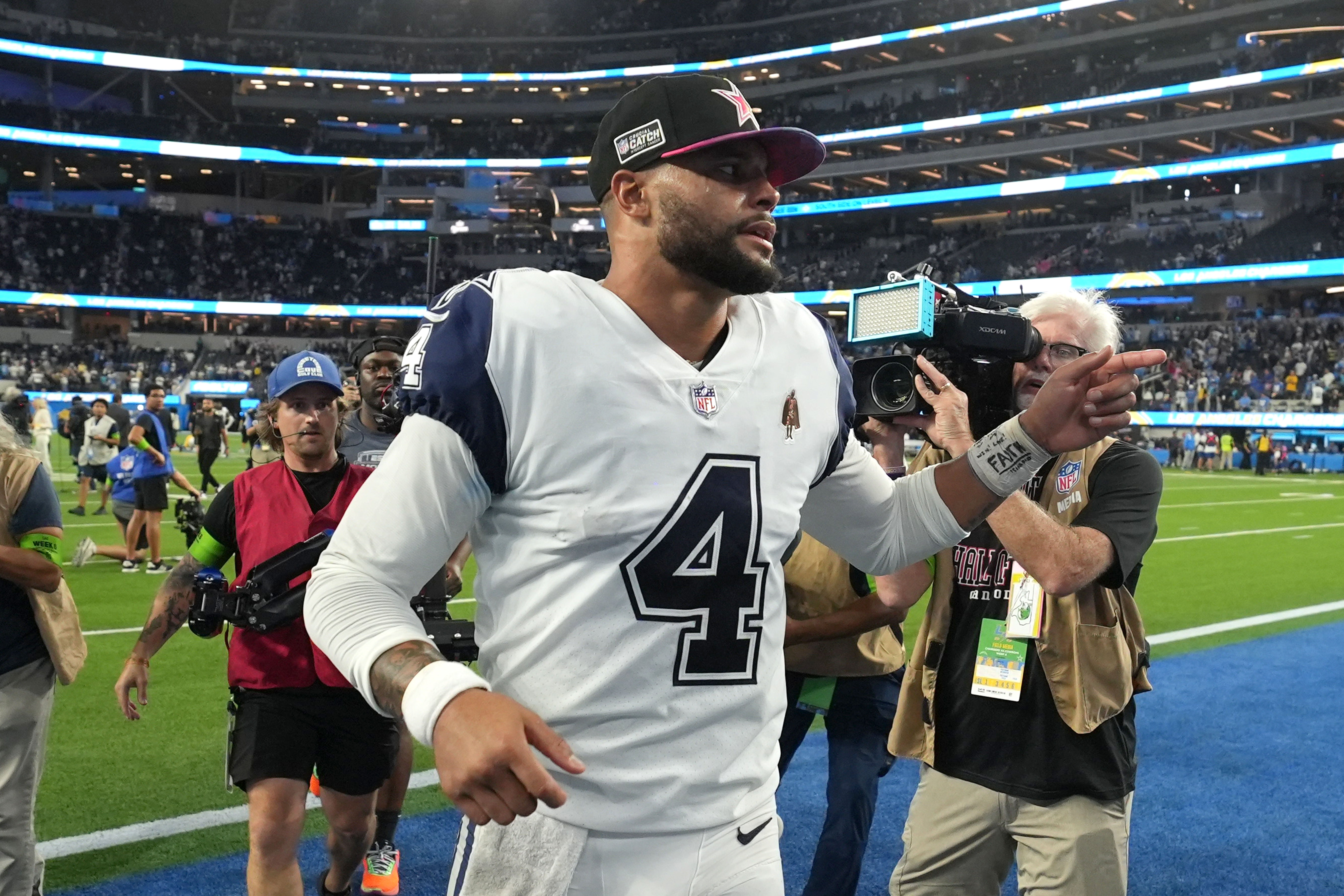 Dallas Cowboys quarterback Dak Prescott (4) leaves the field after the game against the Los Angeles Chargers at SoFi Stadium. Mandatory Credit: Kirby Lee-USA TODAY Sports