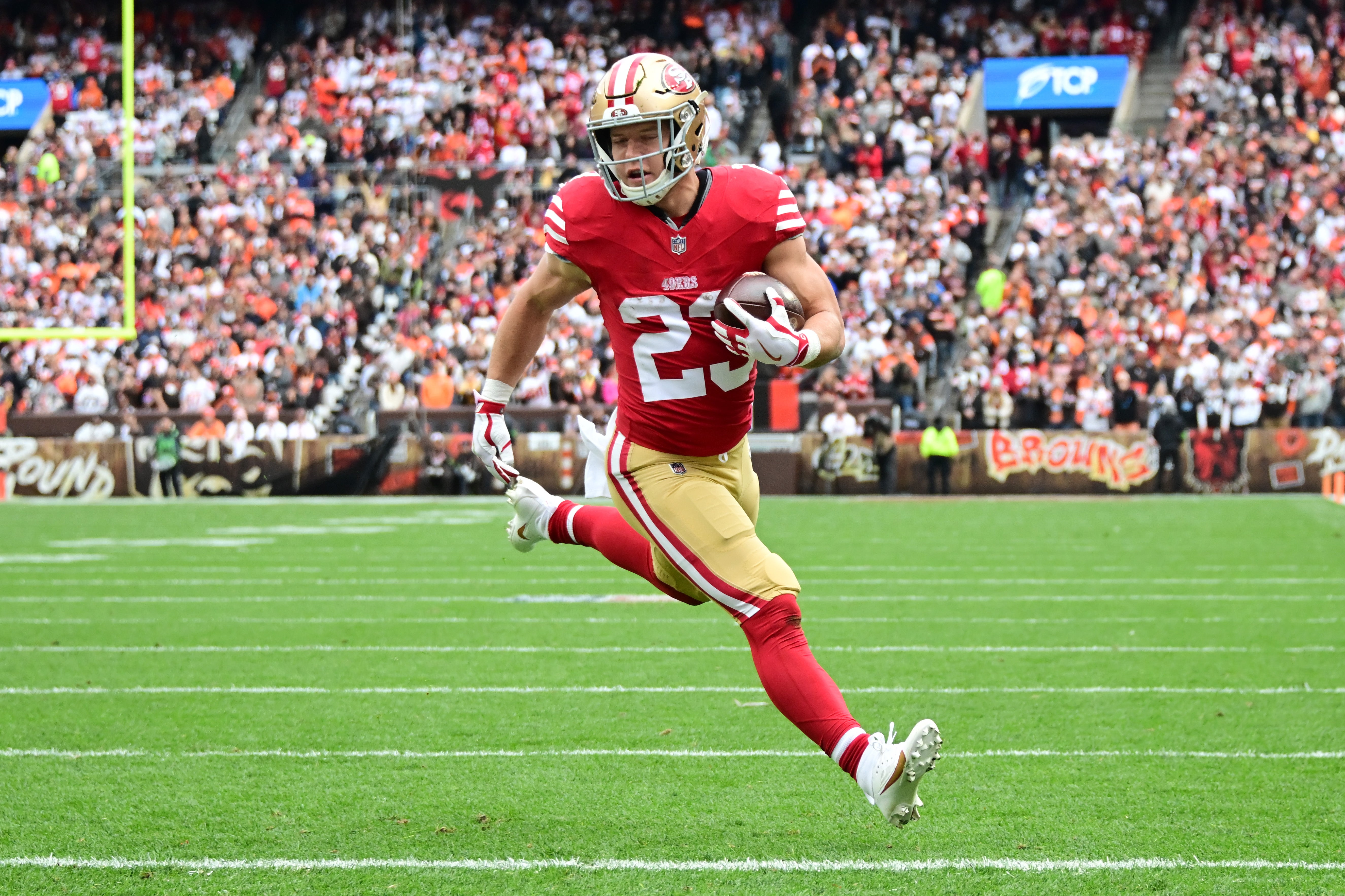 Oct 15, 2023; Cleveland, Ohio, USA; San Francisco 49ers running back Christian McCaffrey (23) scores a touchdown during the first half against the Cleveland Browns at Cleveland Browns Stadium.