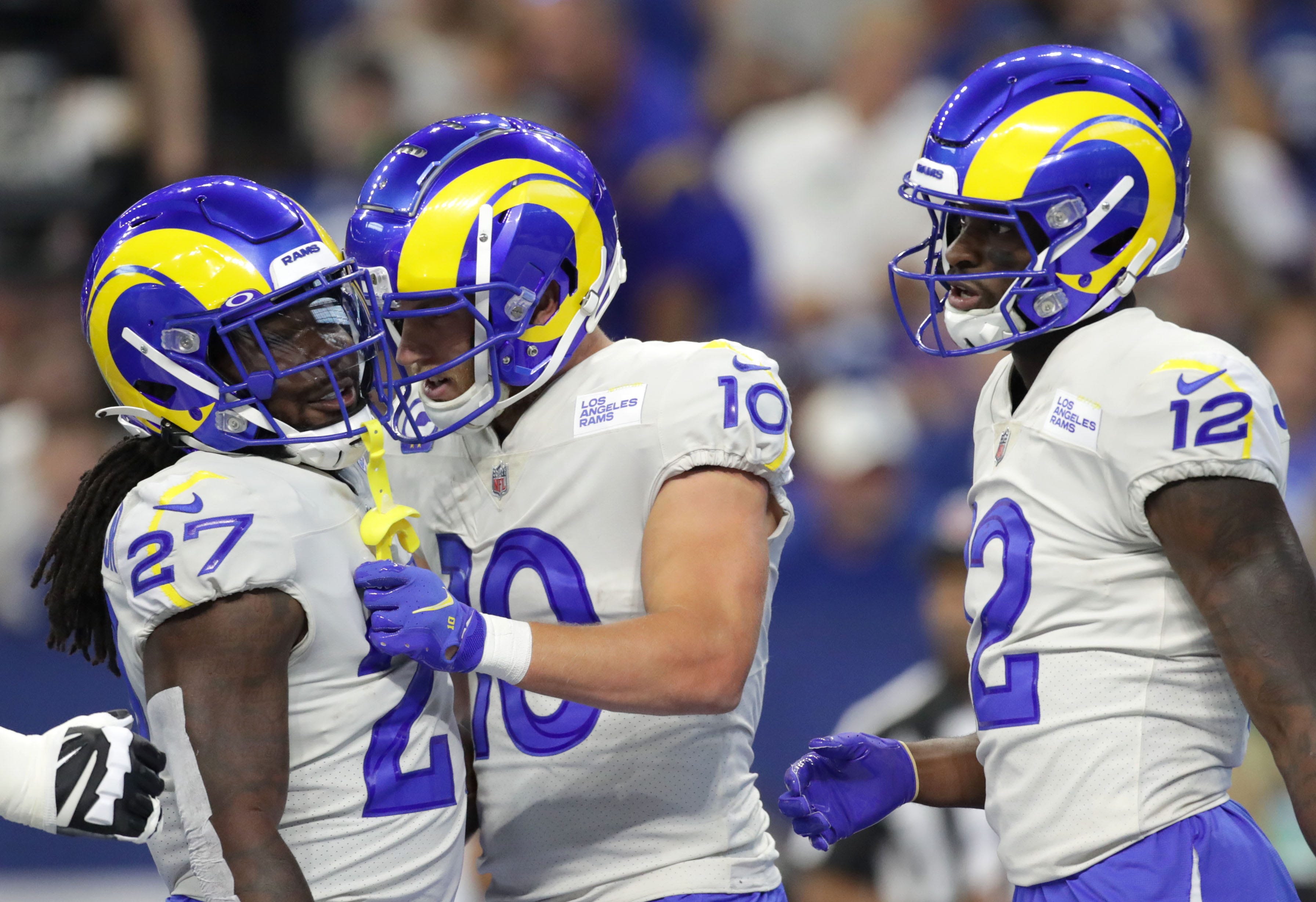 Los Angeles Rams running back Darrell Henderson Jr. (27) and Los Angeles Rams wide receiver Van Jefferson (12) celebrate with Los Angeles Rams wide receiver Cooper Kupp (10) after he scored the opening touchdown Sunday, Sept. 19, 2021, during a game against the Los Angeles Rams at Lucas Oil Stadium in Indianapolis.