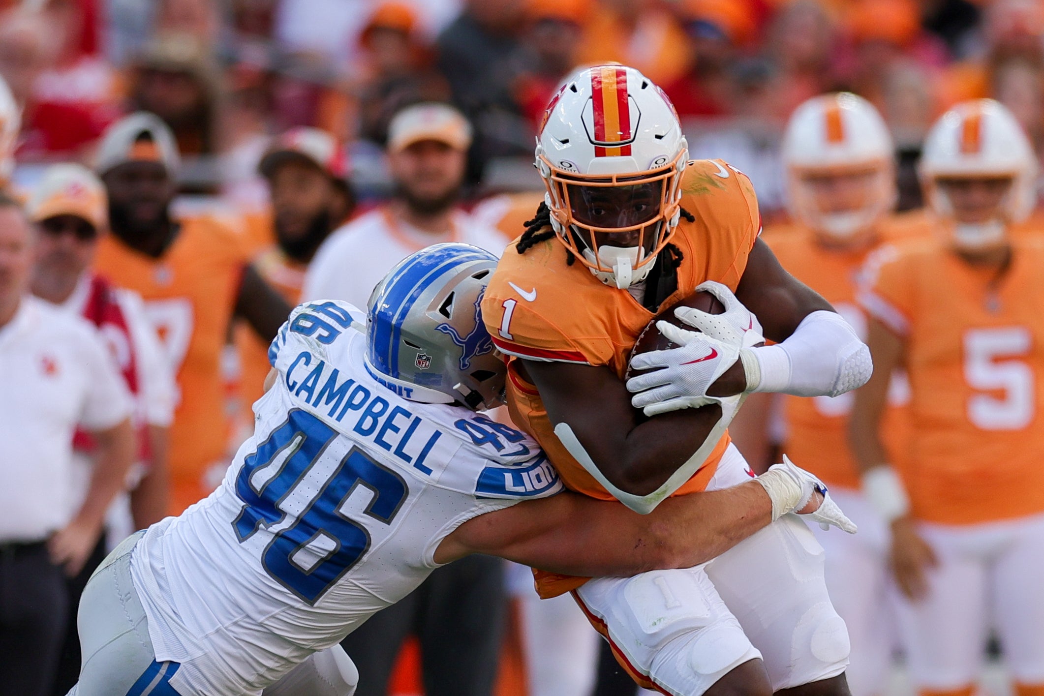 Oct 15, 2023; Tampa, Florida, USA; Detroit Lions linebacker Jack Campbell (46) tackles Tampa Bay Buccaneers running back Rachaad White (1) in the second quarter at Raymond James Stadium. Mandatory Credit: Nathan Ray Seebeck-USA TODAY Sports