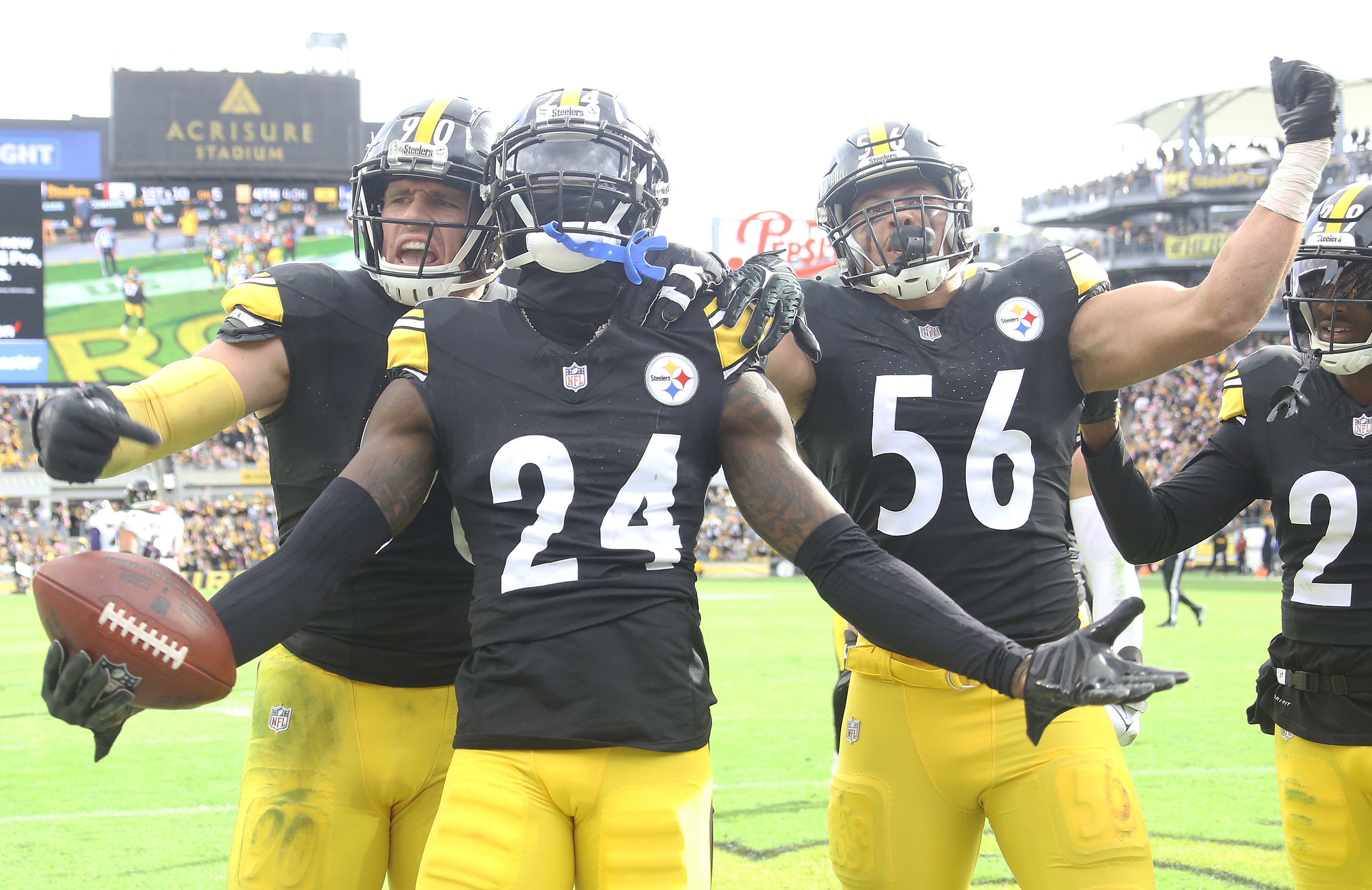Oct 8, 2023; Pittsburgh, Pennsylvania, USA; Pittsburgh Steelers cornerback Joey Porter Jr. (24) celebrates his interception in the end zone with linebacker T.J. Watt (90) and linebacker Alex Highsmith (56) against the Baltimore Ravens during the fourth quarter at Acrisure Stadium. Mandatory Credit: Charles LeClaire-USA TODAY Sports  