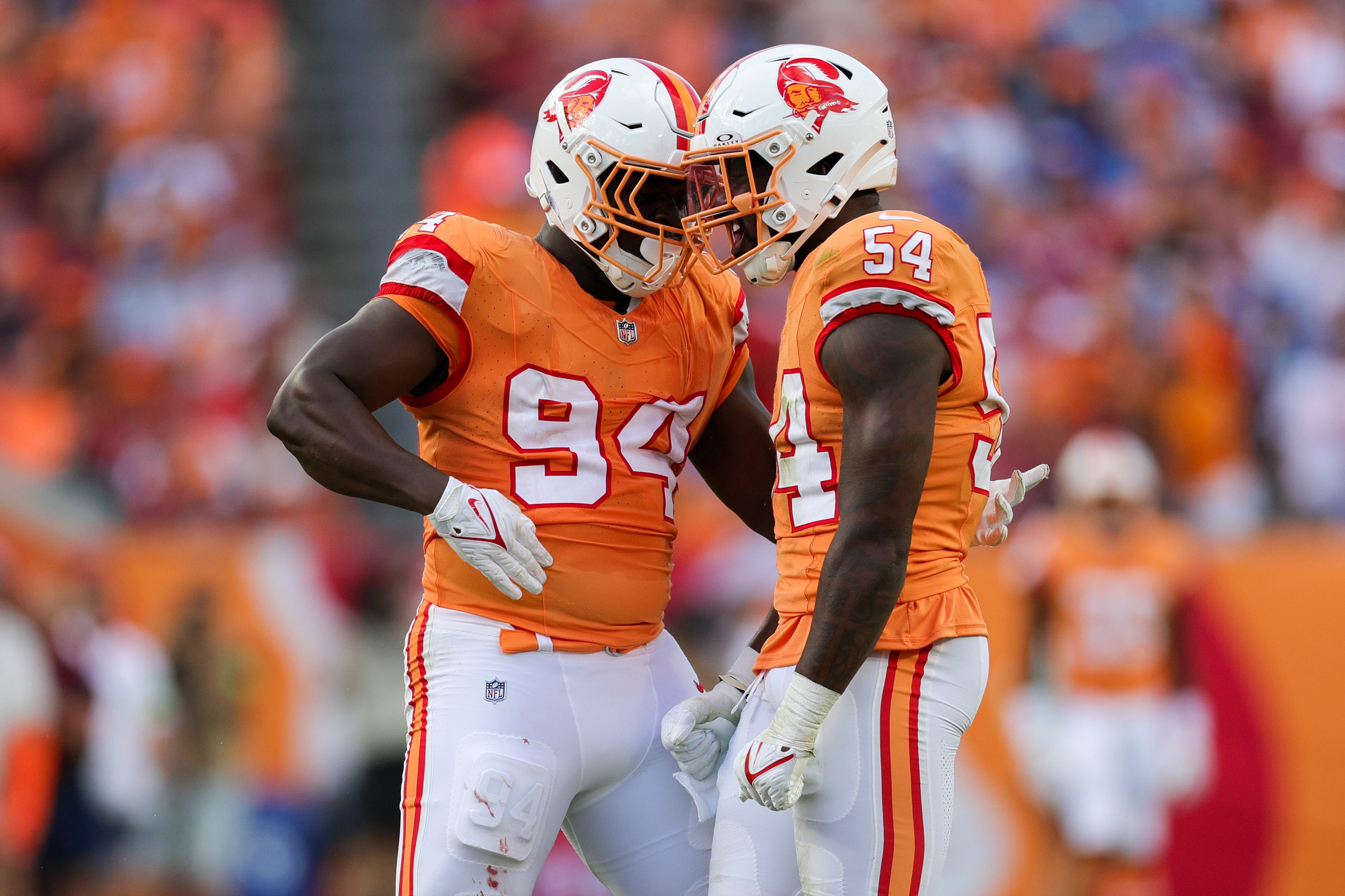 Oct 15, 2023; Tampa, Florida, USA; Tampa Bay Buccaneers linebacker Lavonte David (54) celebrates with defensive tackle Calijah Kancey (94) after sacking Detroit Lions quarterback Jared Goff (16) (not pictured) in the second quarter at Raymond James Stadium. Mandatory Credit: Nathan Ray Seebeck-USA TODAY Sports