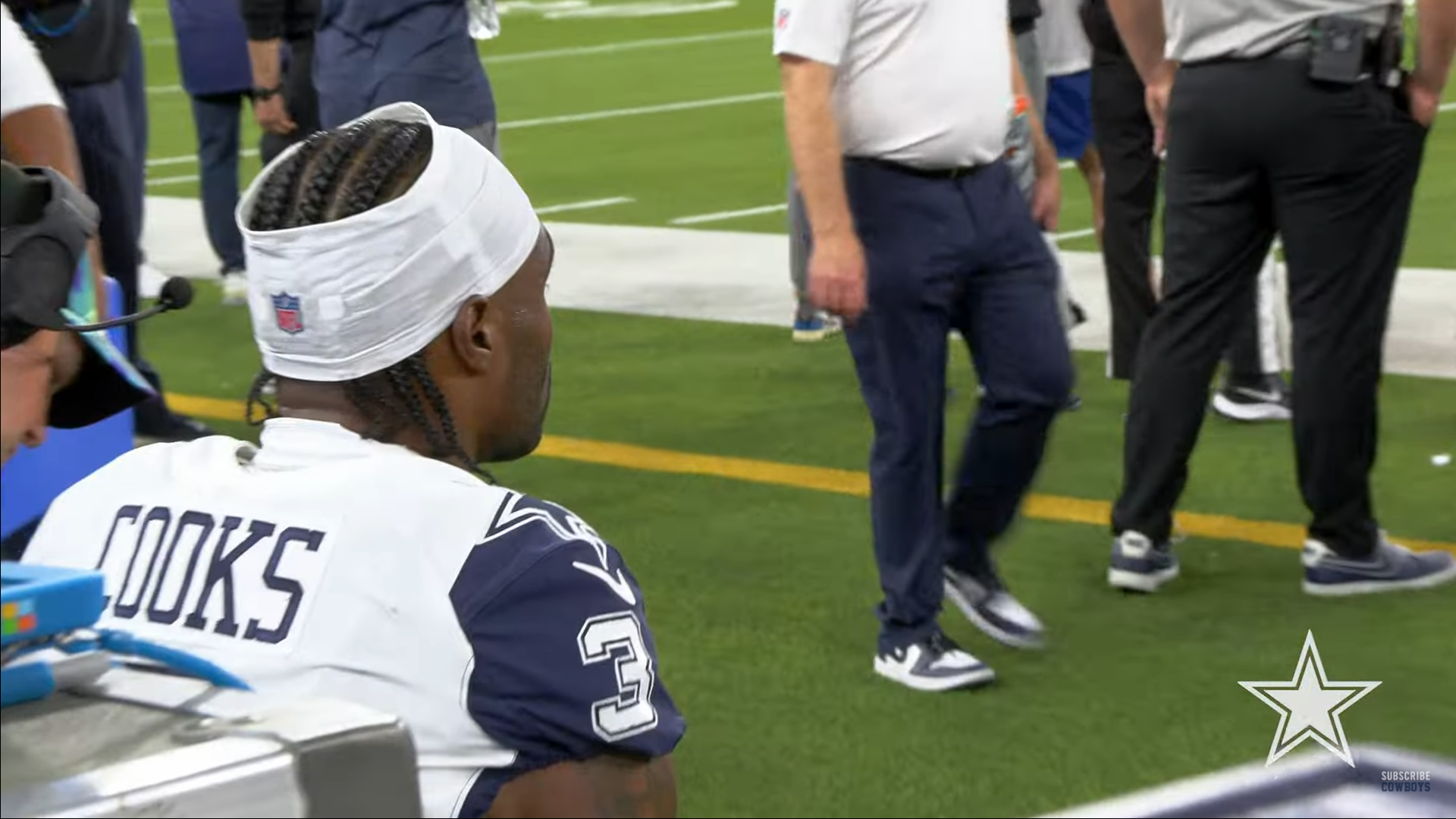 Cowboys WR Brandin Cooks sits on the sidelines during the game versus the L.A. Chargers.