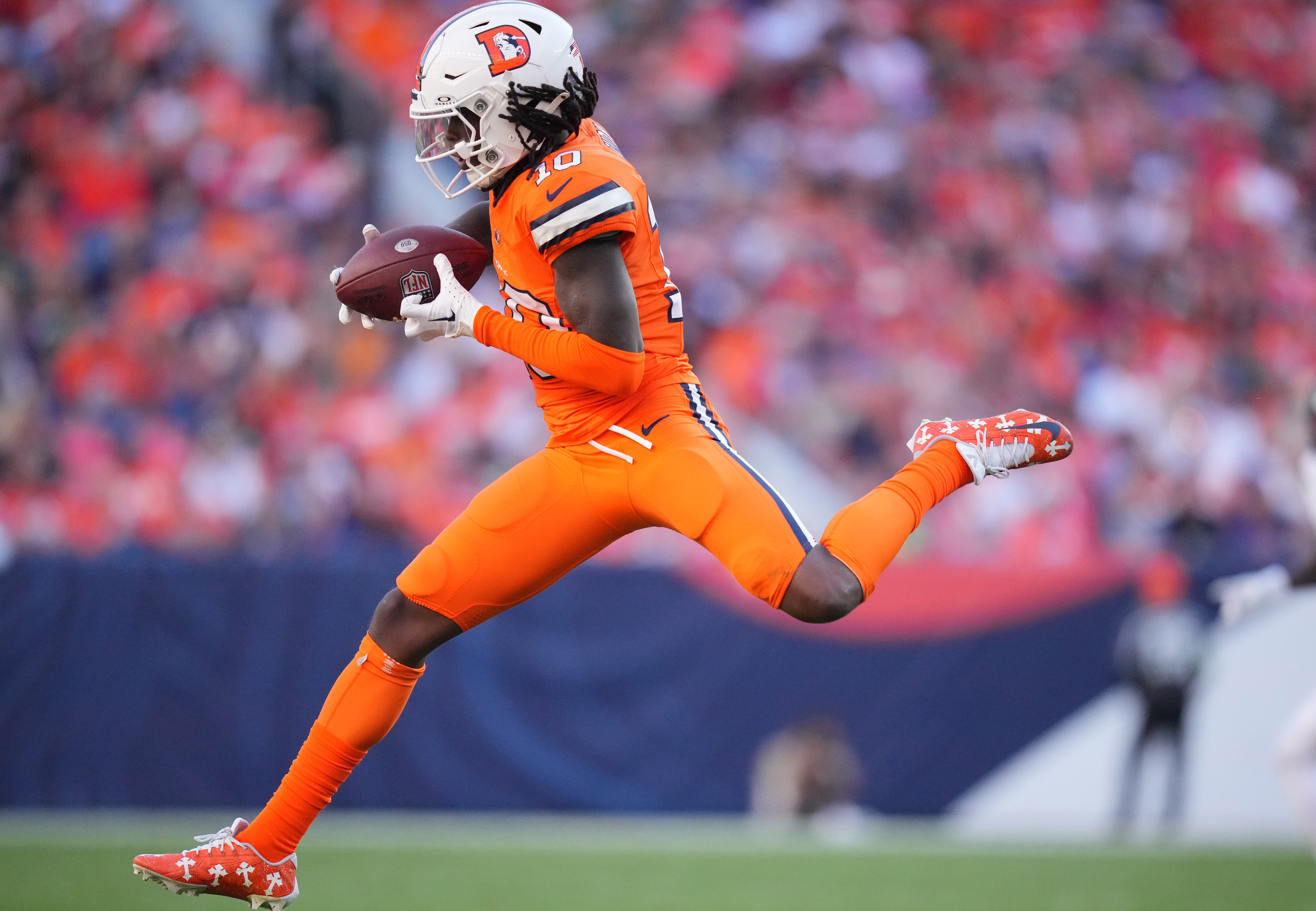 Oct 8, 2023; Denver, Colorado, USA; Denver Broncos wide receiver Jerry Jeudy (10) catches the ball in the second half against the New York Jets at Empower Field at Mile High. Mandatory Credit: Ron Chenoy-USA TODAY Sports