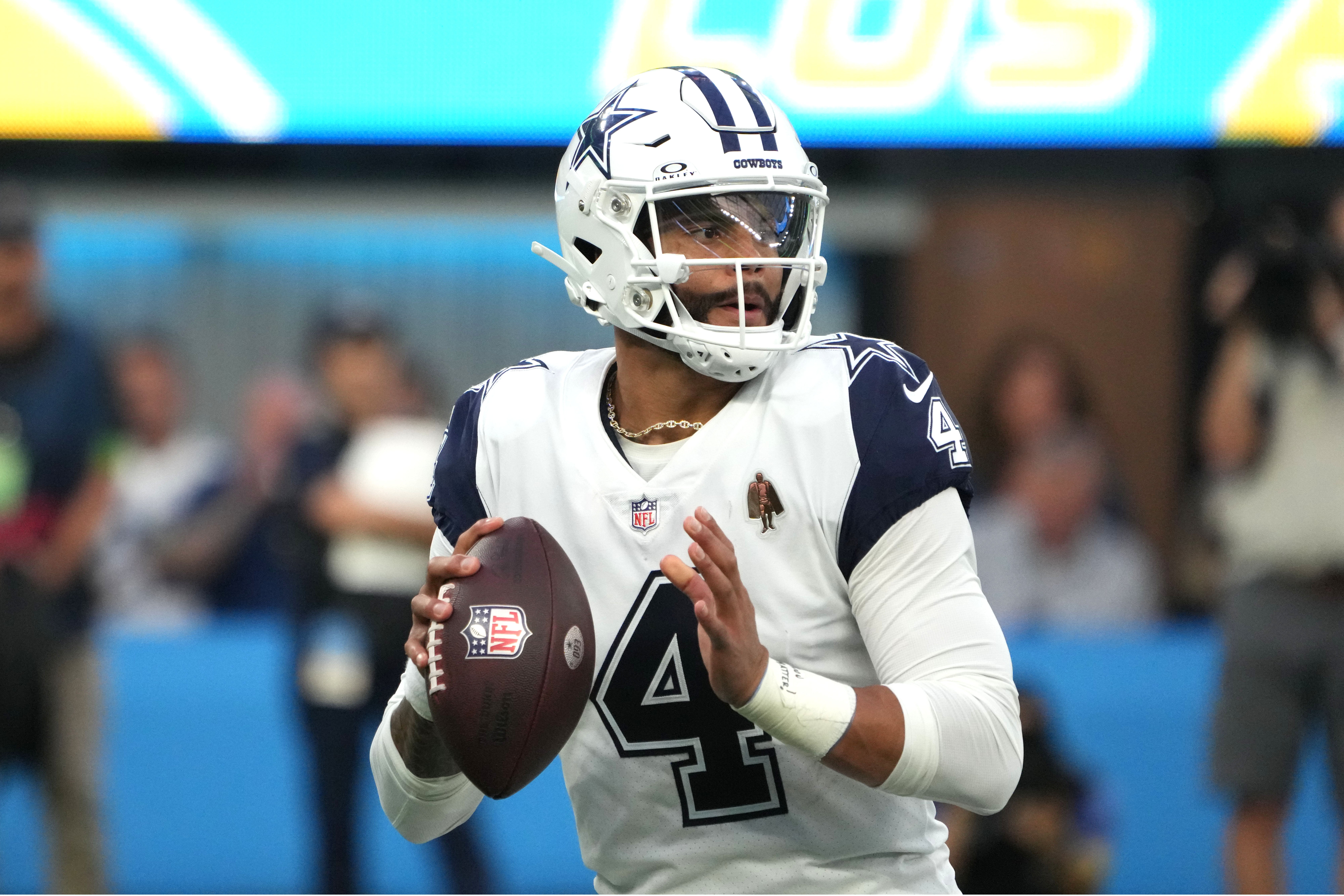 Dallas Cowboys quarterback Dak Prescott (4) throws the ball against the Los Angeles Chargers in the first half at SoFi Stadium. Mandatory Credit: Kirby Lee-USA TODAY Sports