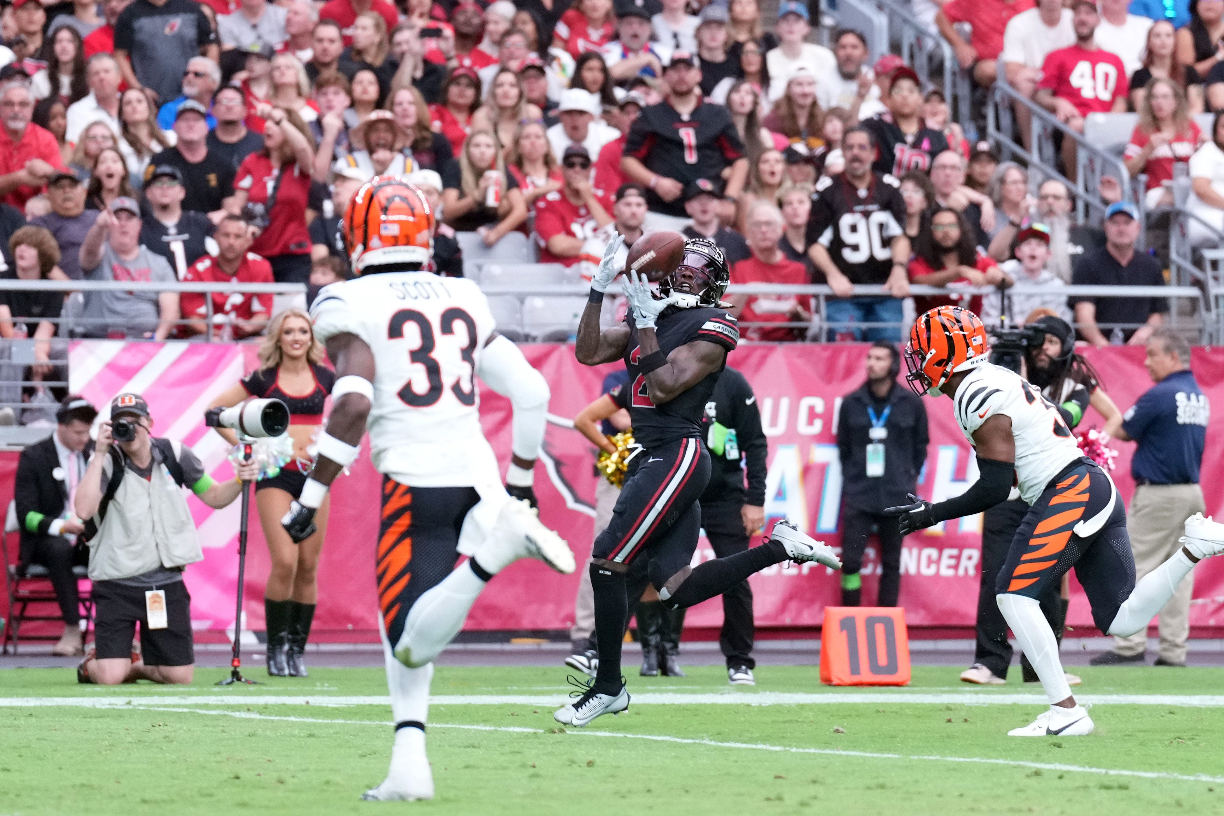 Arizona Cardinals wide receiver Marquise Brown (2) catches a pass and scores a touchdown against the Cincinnati Bengals during the first half at State Farm Stadium.